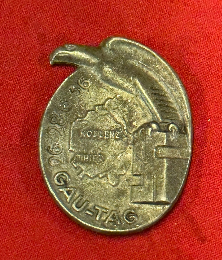 WW2 GERMAN NSDAP GAUTAG KOBLENZ BADGE WITH MISSING LATCH: WW2 GERMAN NSDAP GAUTAG KOBLENZ BADGE WITH MISSING LATCH. SHOWS GOOD WEAR AND MISSING LATCH ON THE REVERSE. A RARE EXAMPLE.
