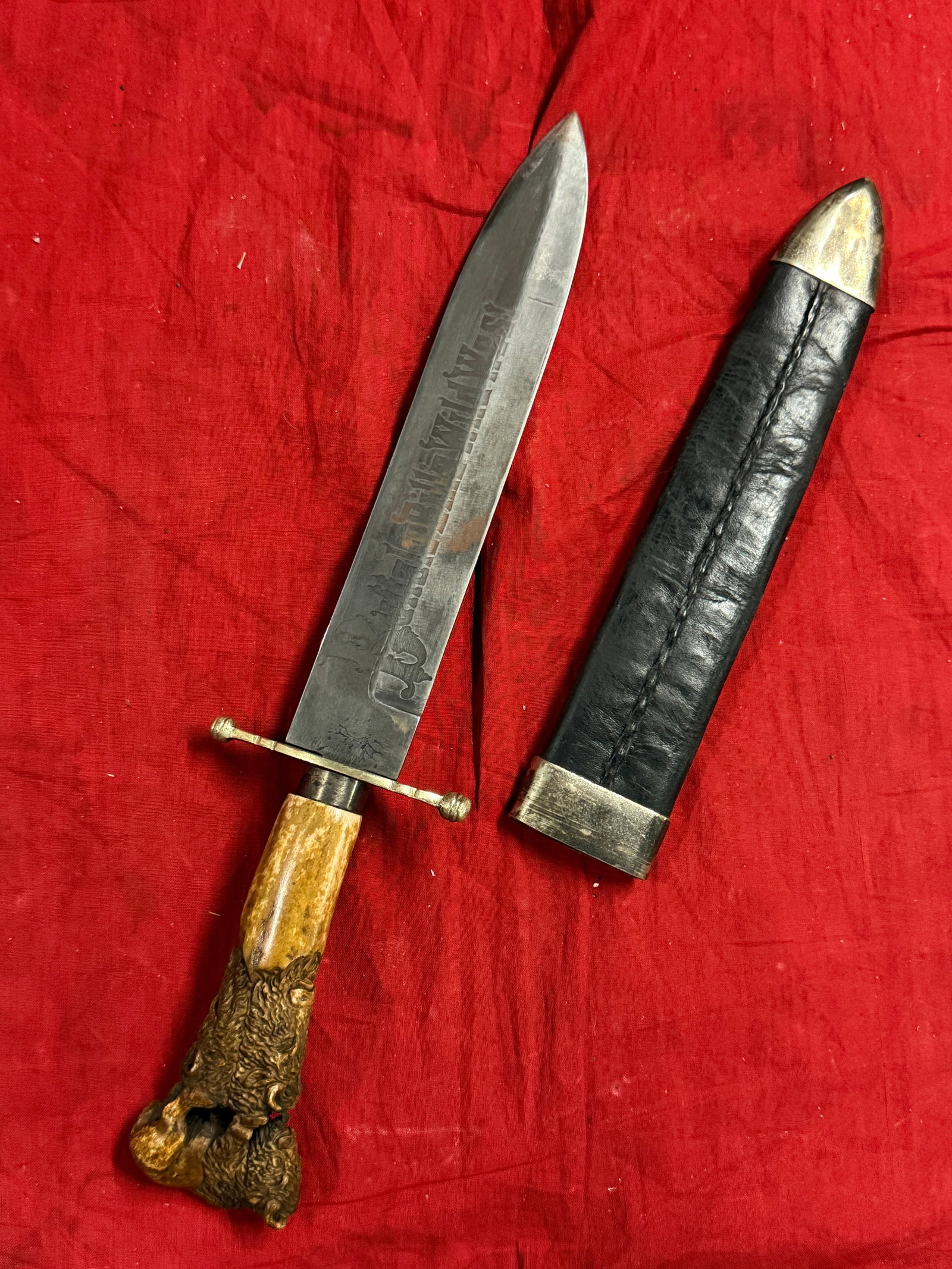 ANTIQUE 1800'S BUFFFALO BILLS WILD WEST BOWIE KNIFE ENGRAVED BULL HANDLE BY J. MOSELEY & SONS: ANTIQUE 1800'S BUFFFALO BILLS WILD WEST BOWIE KNIFE ENGRAVED BULL HANDLE BY J. MOSELEY & SONS. A VERY RARE KNIFE WITH THE ORIGINAL SCABBARD. HAS A GREAT LOOK TO IT WITH AN EXCELLENT OVERALL EYE APPEAL