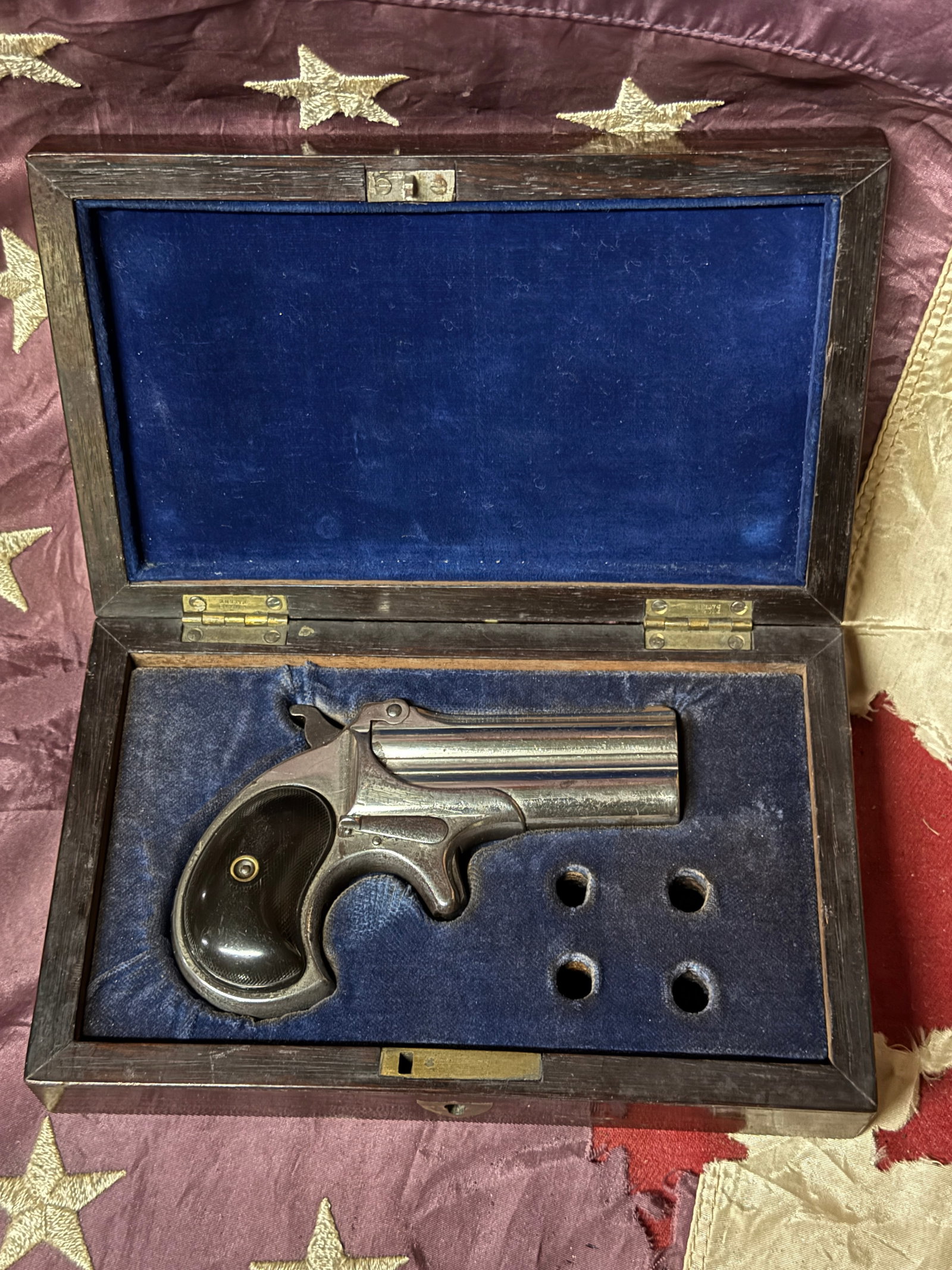 C. 1890 REMINGTON .41 RIMFIRE OVER/UNDER DERRINGER PISTOL IN ORIGINAL BOX: C. 1890 REMINGTON .41 RIMFIRE OVER/UNDER DERRINGER PISTOL IN ORIGINAL BOX. Remington .41 rimfire over and under Derringer pistol, 3 inch barrels stamped Remington Arms Co. Ilion. N.Y. With hard rubber