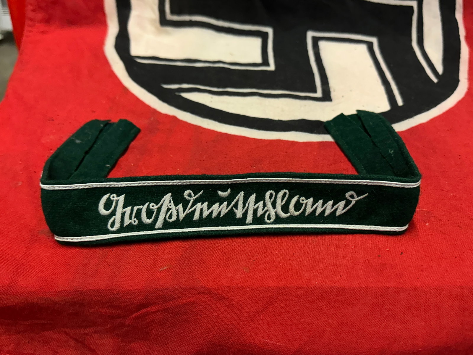 WW2 GERMAN GROSSDEUTSCHLAND ENLISTED MAN CUFF TITLE - GREEN: WW2 GERMAN GROSSDEUTSCHLAND ENLISTED MAN CUFF TITLE - GREEN. Gothic Script. Green Enlisted man cuff title are machine-embroidered in gray thread with white piping. A rare find.