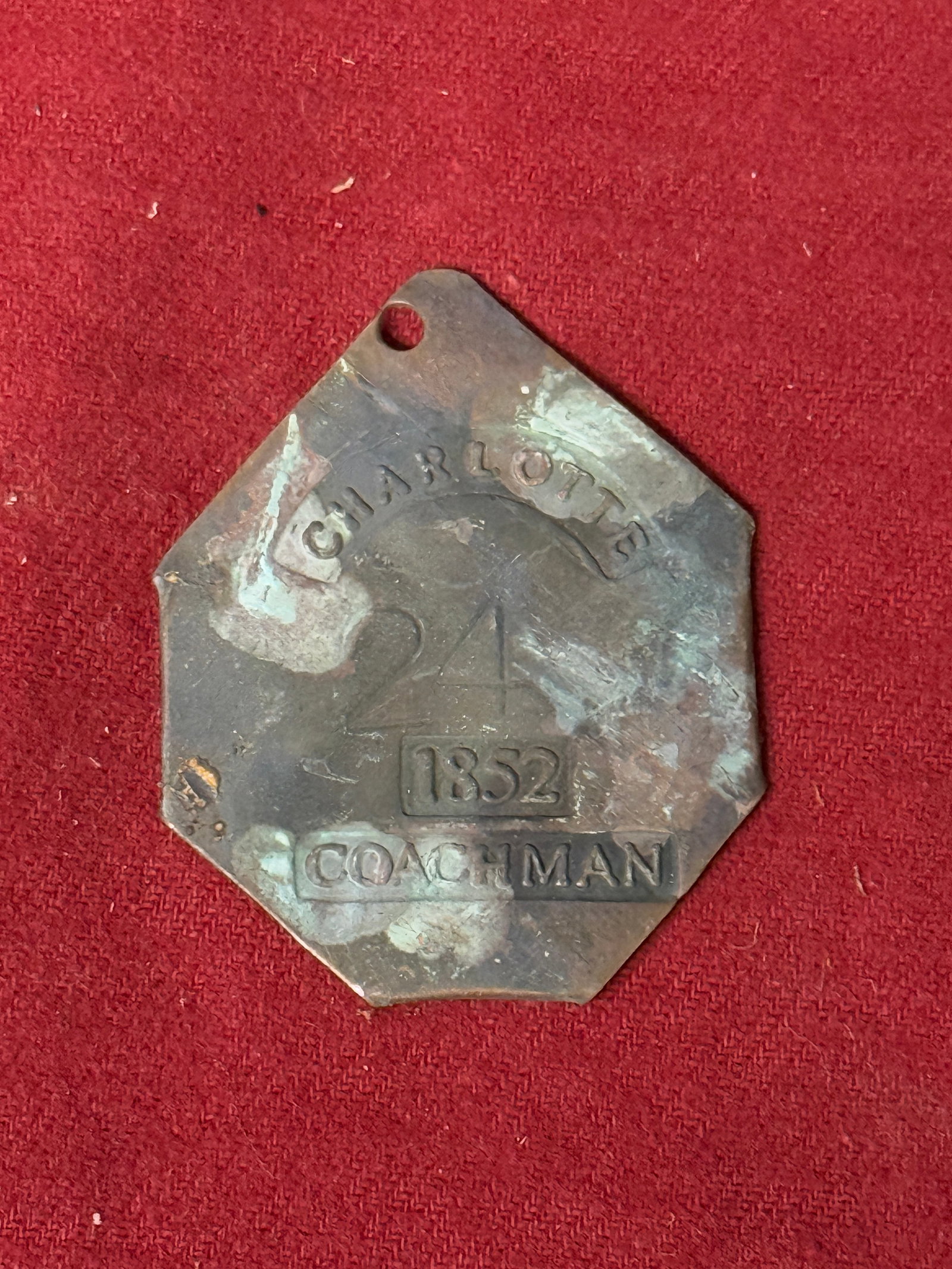 DATED 1852 CHARLOTTE COACHMAN SLAVE TAG SERVANT ID: DATED 1852 CHARLOTTE COACHMAN SLAVE TAG SERVANT ID. AN ULTRA RARE FIND THAT IS IN MINT OVERALL SHAPE AND CONDITION WITH A BEAUTIFUL OVERALL PATINA. SHOWS GOOD WEAR AND USE. PLEASE VIEW ALL DETAILED PI