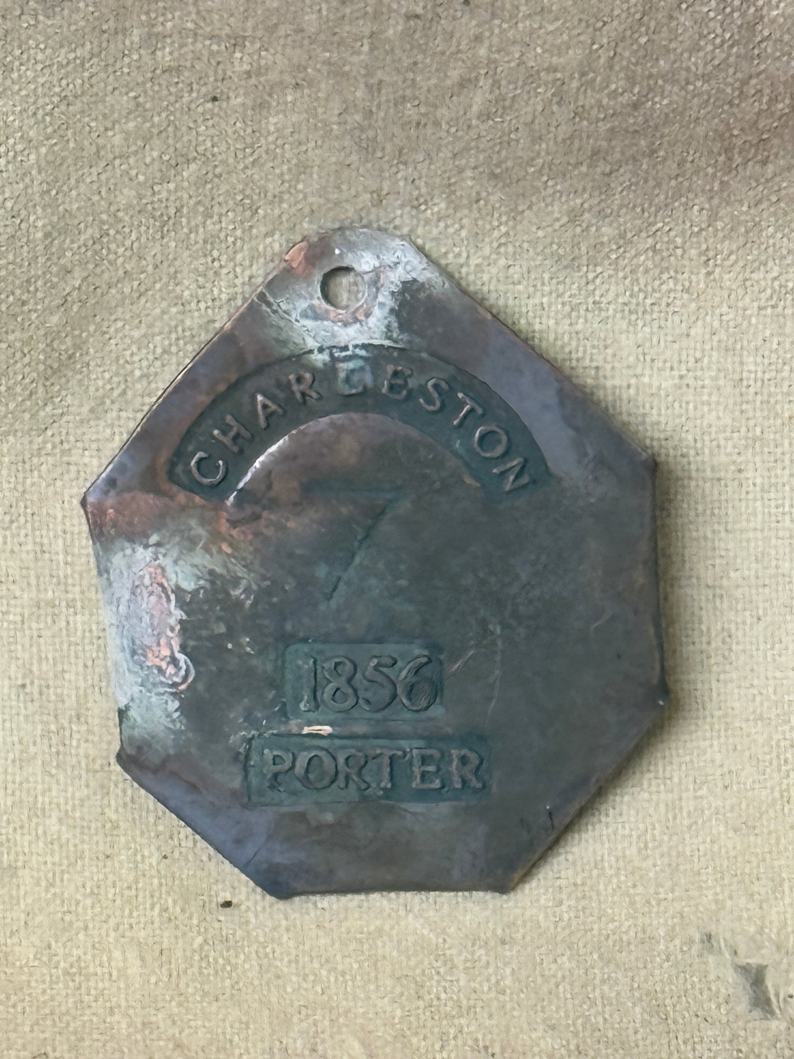 DATED 1856 #7 CHARLESTON PORTER SLAVE TAG SERVANT ID: DATED 1856 #7 CHARLESTON PORTER SLAVE TAG SERVANT ID. AN ULTRA RARE FIND THAT IS IN MINT OVERALL SHAPE AND CONDITION WITH A BEAUTIFUL OVERALL PATINA. SHOWS GOOD WEAR AND USE. PLEASE VIEW ALL DETAILED 
