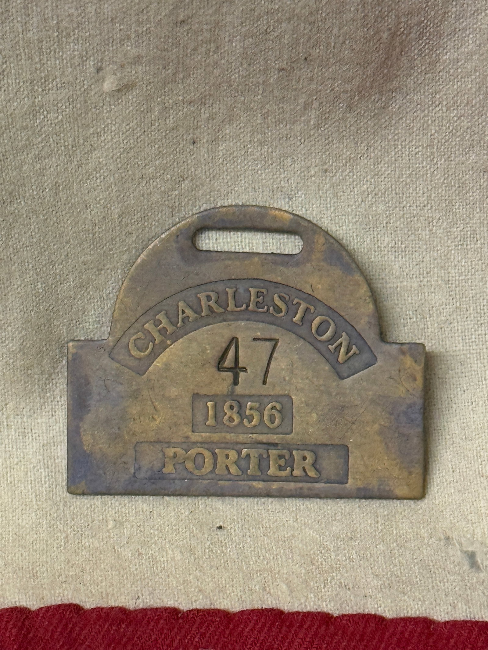 DATED 1856 #47 CHARLESTON PORTER SLAVE TAG SERVANT ID: DATED 1856 #47 CHARLESTON PORTER SLAVE TAG SERVANT ID. AN ULTRA RARE FIND THAT IS IN MINT OVERALL SHAPE AND CONDITION WITH A BEAUTIFUL OVERALL PATINA. SHOWS GOOD WEAR AND USE. PLEASE VIEW ALL DETAILED
