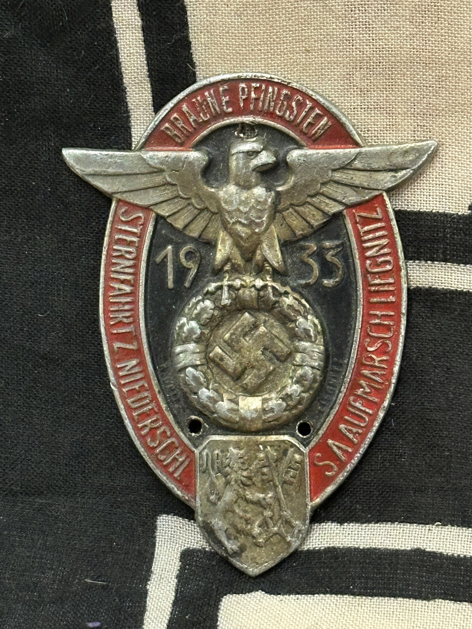 WWII German NSKK Commemorative 1933 Badge: WWII German NSKK Commemorative 1933 Badge. This WW2 German commemorative Badge “1933 1000 km durch Deutschland NSKK” (1000 km in Germany NSKK in 1933), 3 Reich, in honor of the car rally in Ge
