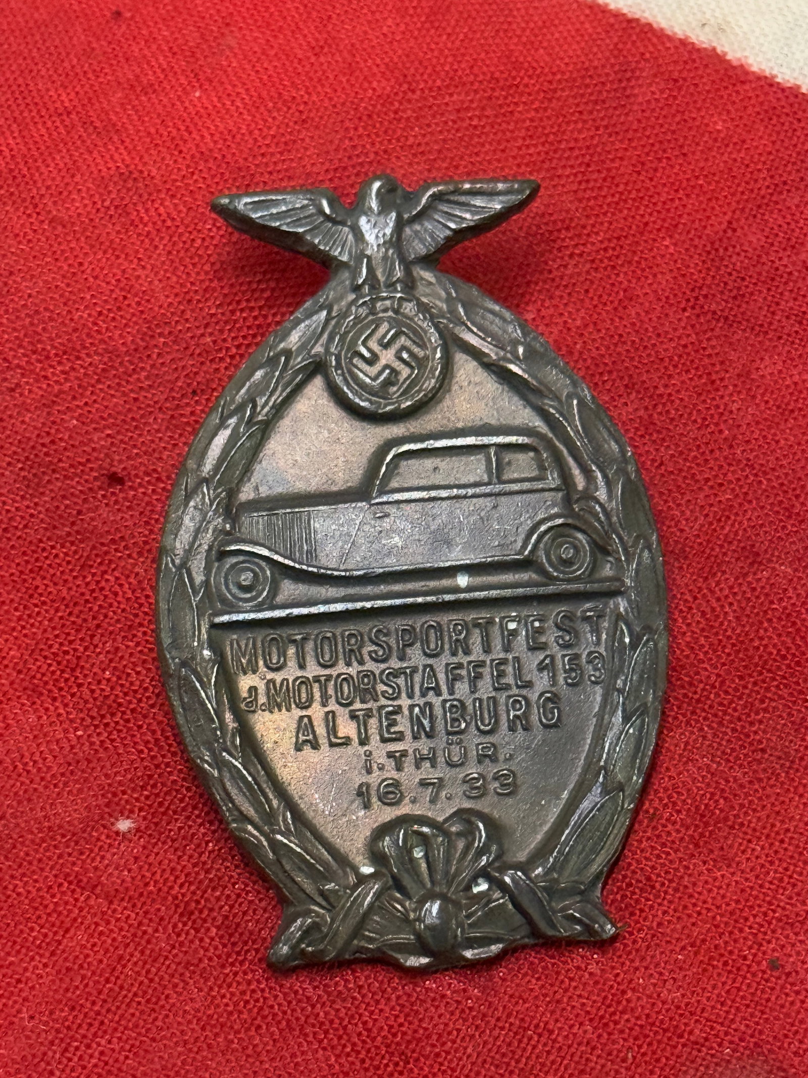 WW2 GERMAN NSKK TINNIE BADGE: WW2 GERMAN NSKK TINNIE BADGE . A RARE EXAMPLE THAT IS IN MINT OVERALL SHAPE AND CONDITION WITH A BEAUTIFUL OVERALL PATINA. SHOWS GOOD WEAR AND USE. A RARE EXAMPLE.