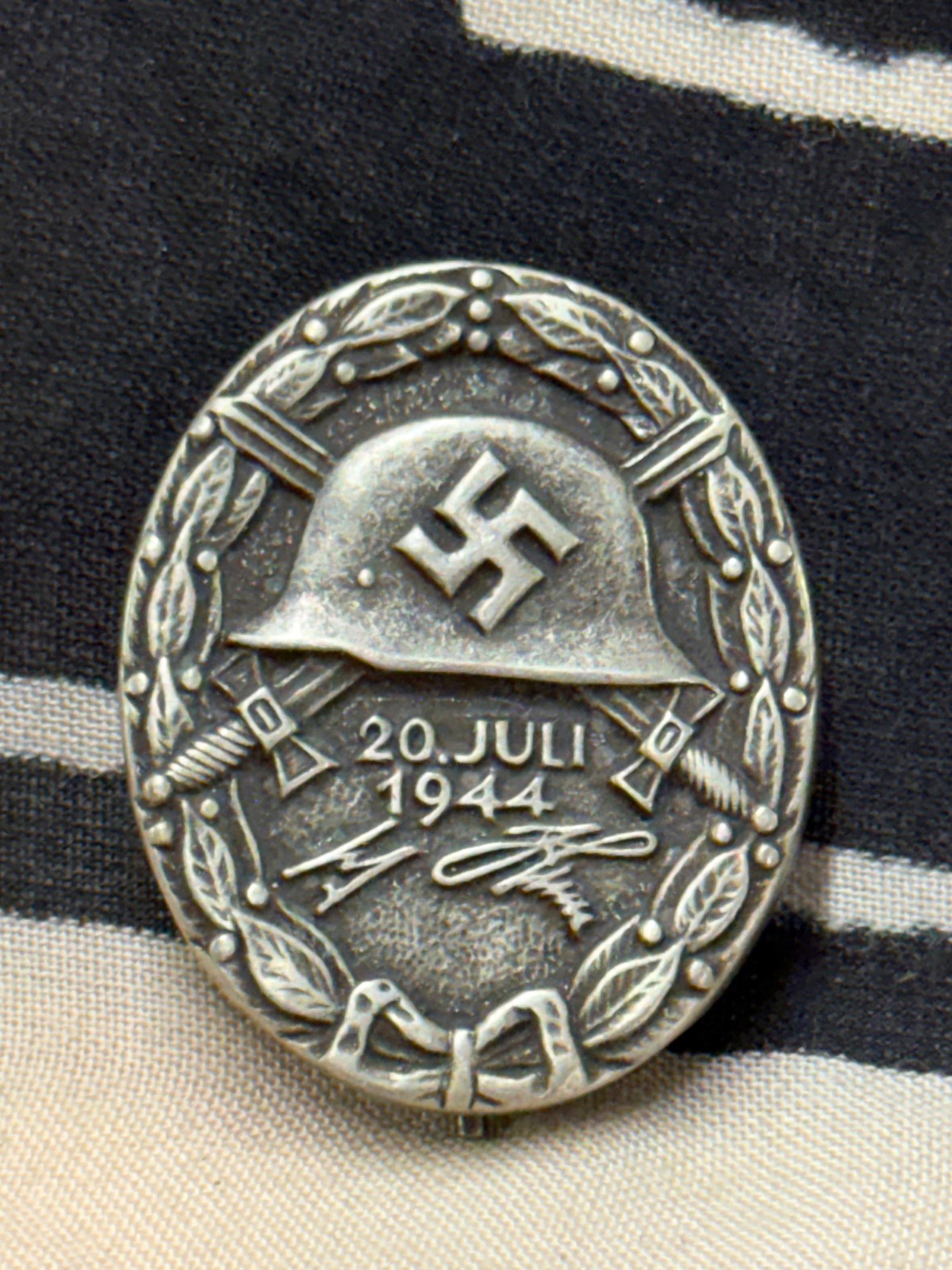 WWII GERMAN THIRD REICH OP VALKYRIE WOUND BADGE MARKED L/12: WWII GERMAN THIRD REICH OP VALKYRIE WOUND BADGE MARKED L/12. A VERY RARE EXAMPLE THAT IS IN MINT OVERALL SHAPE AND CONDITION WITH A BEAUTIFUL OVERALL PATINA. SHOWS GOOD WEAR AND USE. PLEASE VIEW ALL D
