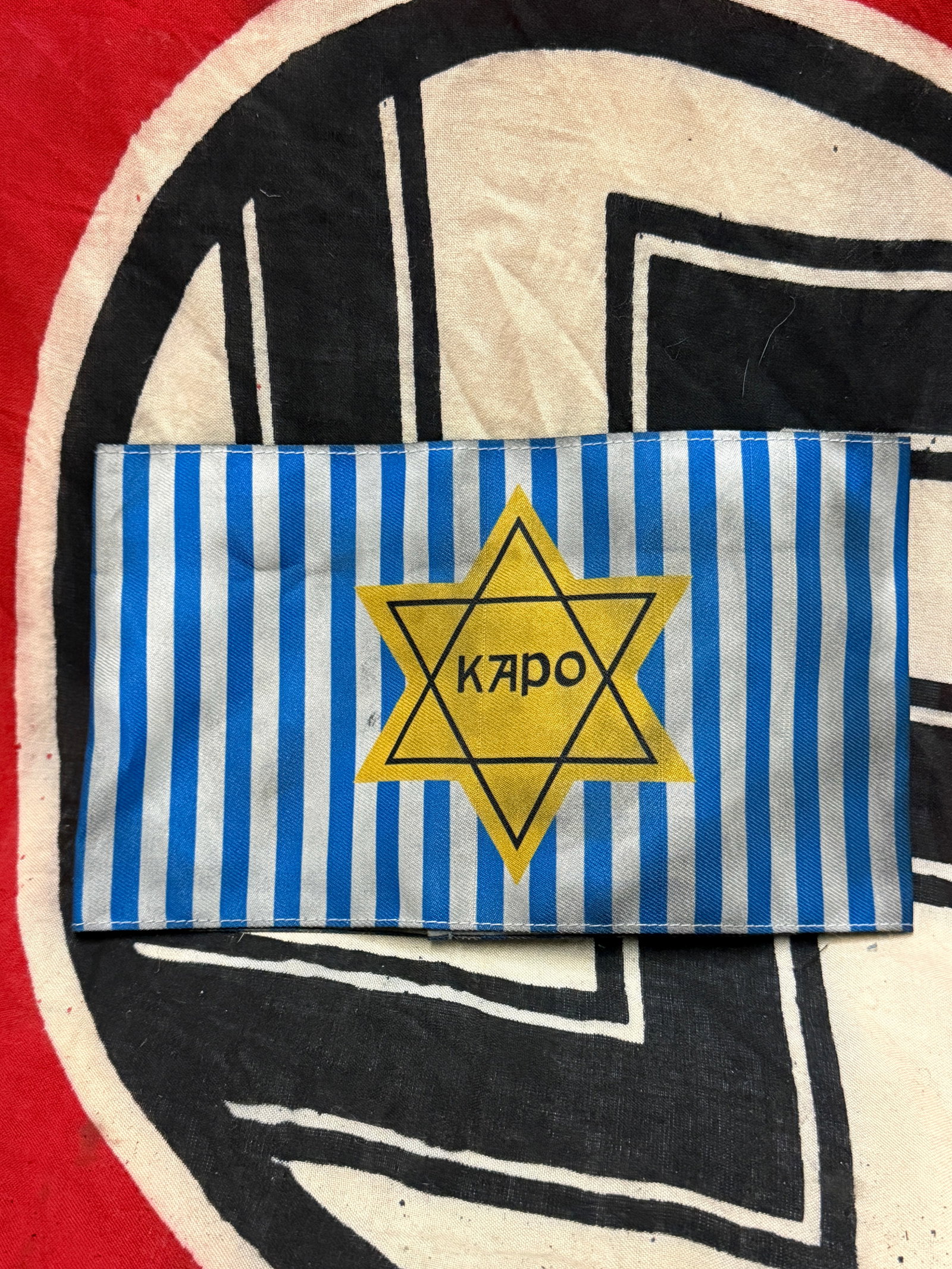 RARE WW2 GERMAN CONCENTRATION CAMP KAPO STAR OF DAVID ARMBAND: RARE WW2 GERMAN CONCENTRATION CAMP KAPO STAR OF DAVID ARMBAND. A RARE FIND. SHOWS GOOD WEAR AND USE WITH A BEAUTIFUL OVERALL PATINA. PLEASE VIEW ALL DETAILED PICTURES. A VERY RARE EXAMPLE.