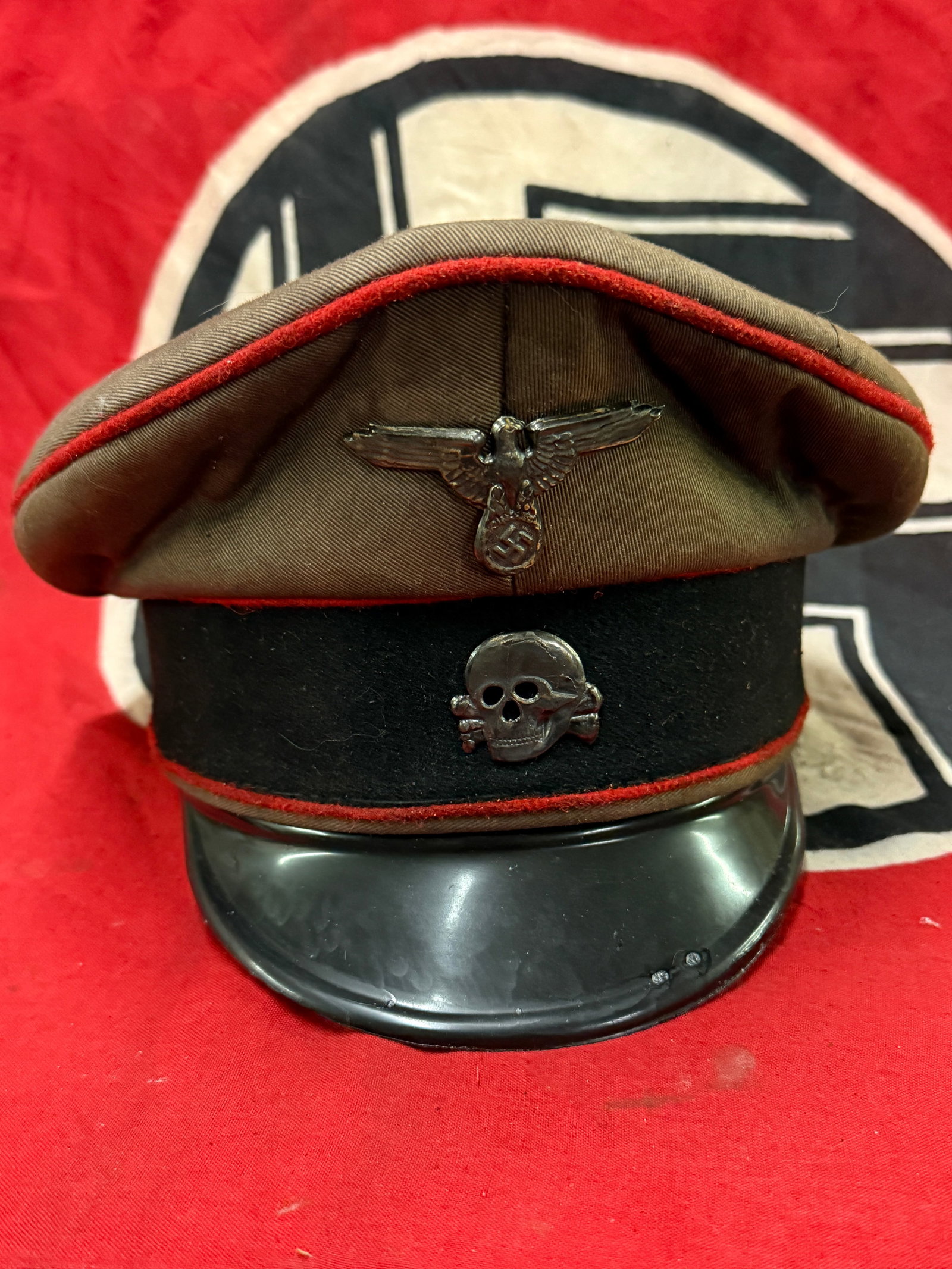 WW2 GERMAN WAFFEN-SS PANZER VISOR CAP WITH RZM PAPER TAG: WW2 GERMAN WAFFEN-SS PANZER VISOR CAP WITH RZM PAPER TAG. A RARE EXAMPLE. HAS THE MAKER MARK TAG ON THE INSIDE. PLEASE VIEW ALL DETAILED PICTURES. A RARE EXAMPLE.