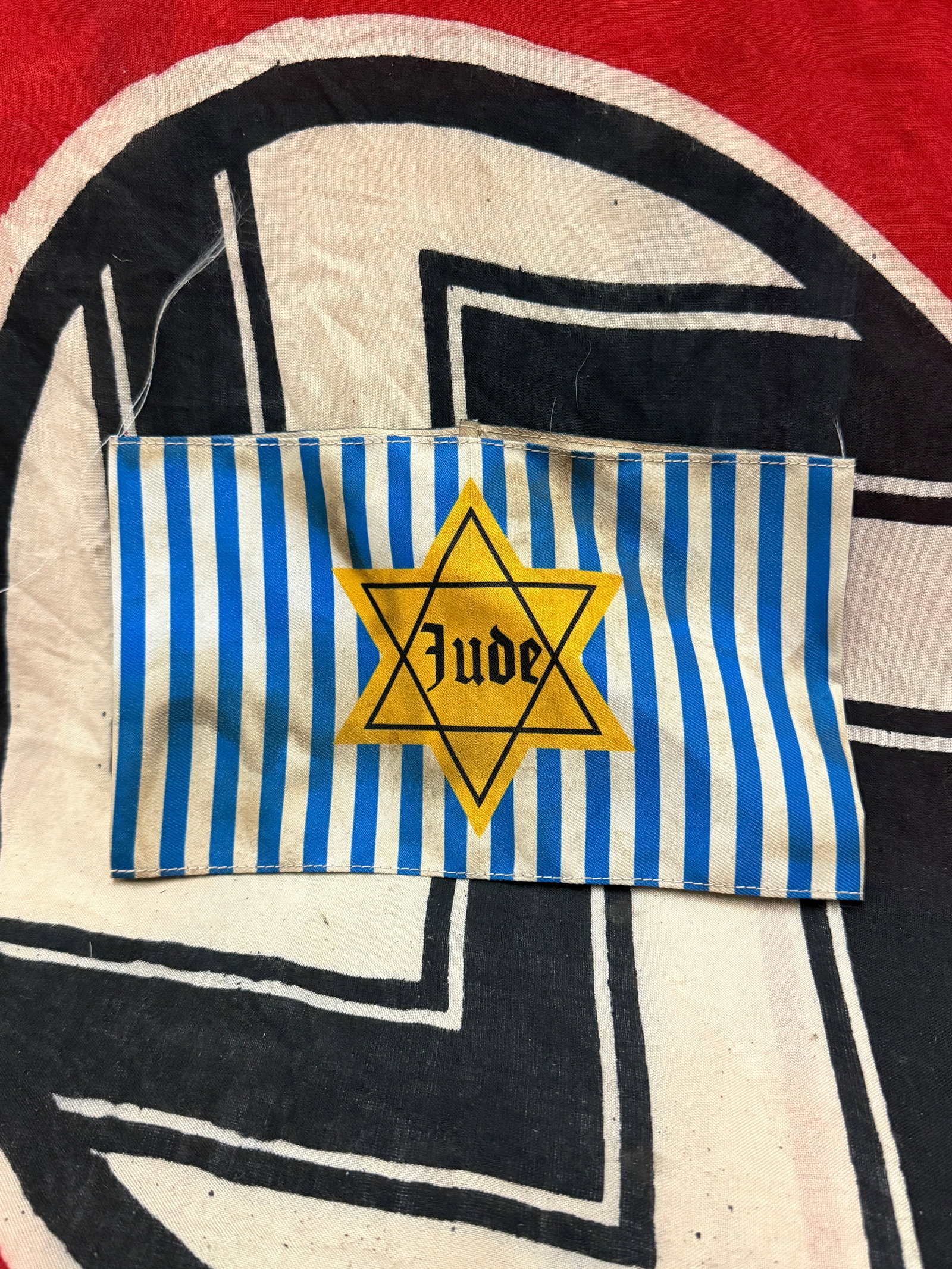 WW2 GERMAN STAR OF DAVID JUDE CONCENTRATION CAMP ARMBAND: WW2 GERMAN STAR OF DAVID JUDE CONCENTRATION CAMP ARMBAND. AN ULTRA RARE FIND THAT IS IN MINT OVERALL SHAEP AND CONDITION WITH A BEAUTIFUL OVERALL PATINA. SHOWS GOOD WEAR AND USE. PLEASE VIEW ALL DETAI