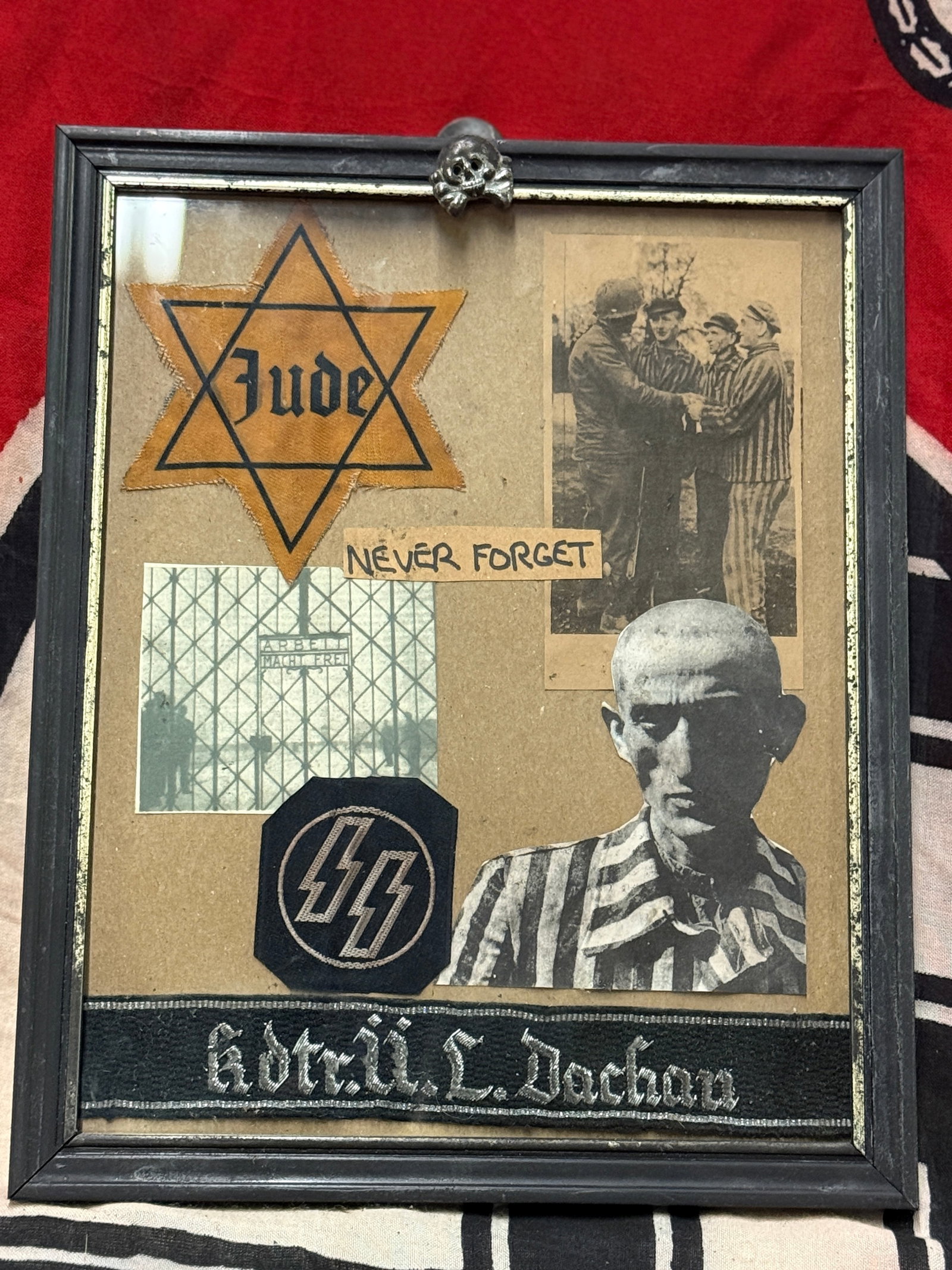 FRAMED SET OF WW2 GERMAN CONCENTRATION CAMP ARTIFACTS FROM DACHAU CAMP: FRAMED SET OF WW2 GERMAN CONCENTRATION CAMP ARTIFACTS FROM DACHAU CAMP - MADE BY A VET BRING BACK. A WELL MADE WALL HANGER. PLEASE VIEW ALL DETAILED PICTURES. INCLUDES: CUFF TITLE, STAR OF DAVID, ETC.