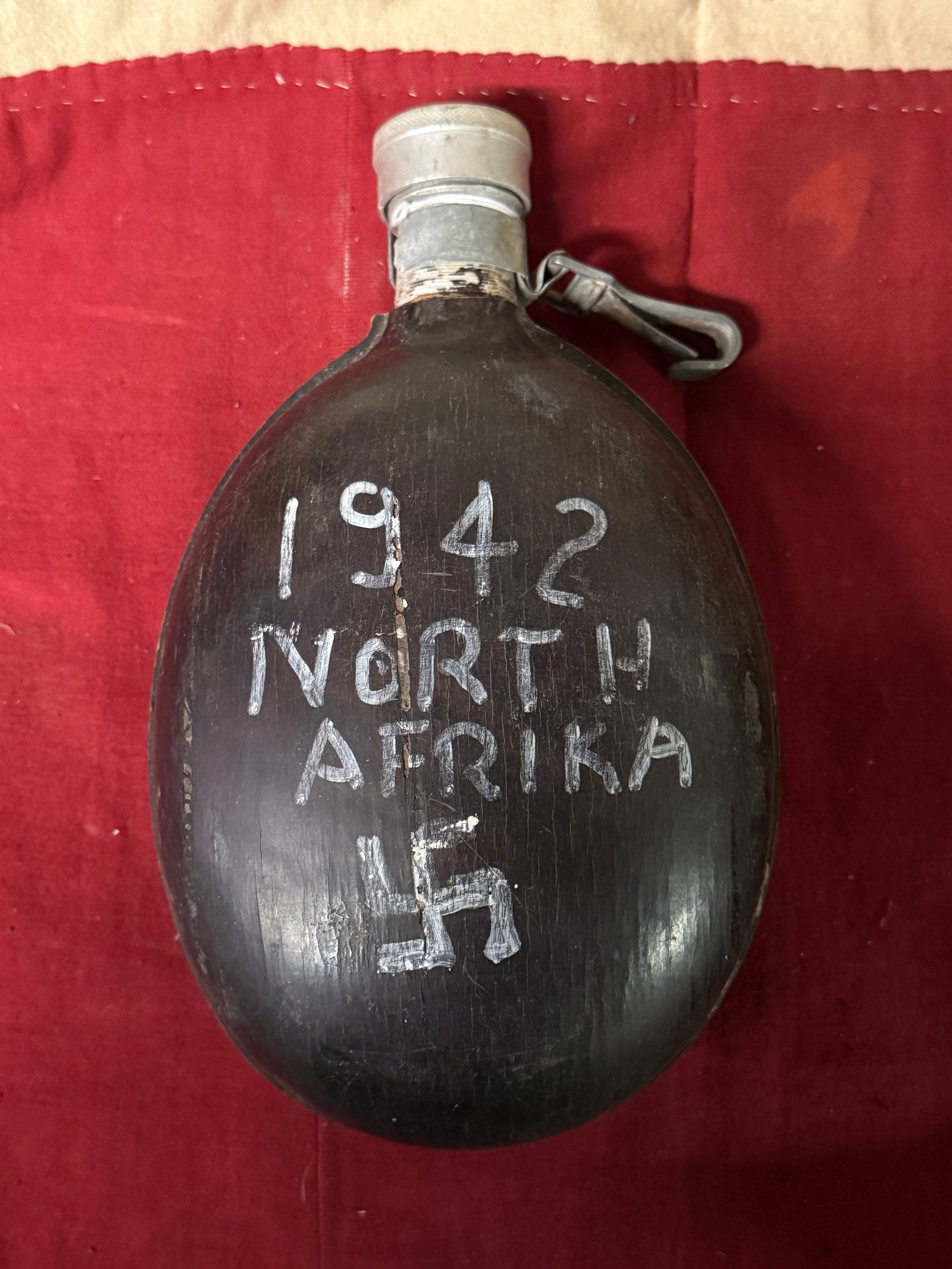 1942 WW2 GERMAN MARKED NORTH AFRIKA KORPS CANTEEN: 1942 WW2 GERMAN MARKED NORTH AFRIKA KORPS CANTEEN. A RARE EXAMPLE THAT SHOWS GOOD WEAR AND USE WITH A BEAUTIFUL OVERALL PATINA. PLEASE VIEW ALL DETAILED PICTURES. A RARE EXAMPLE.