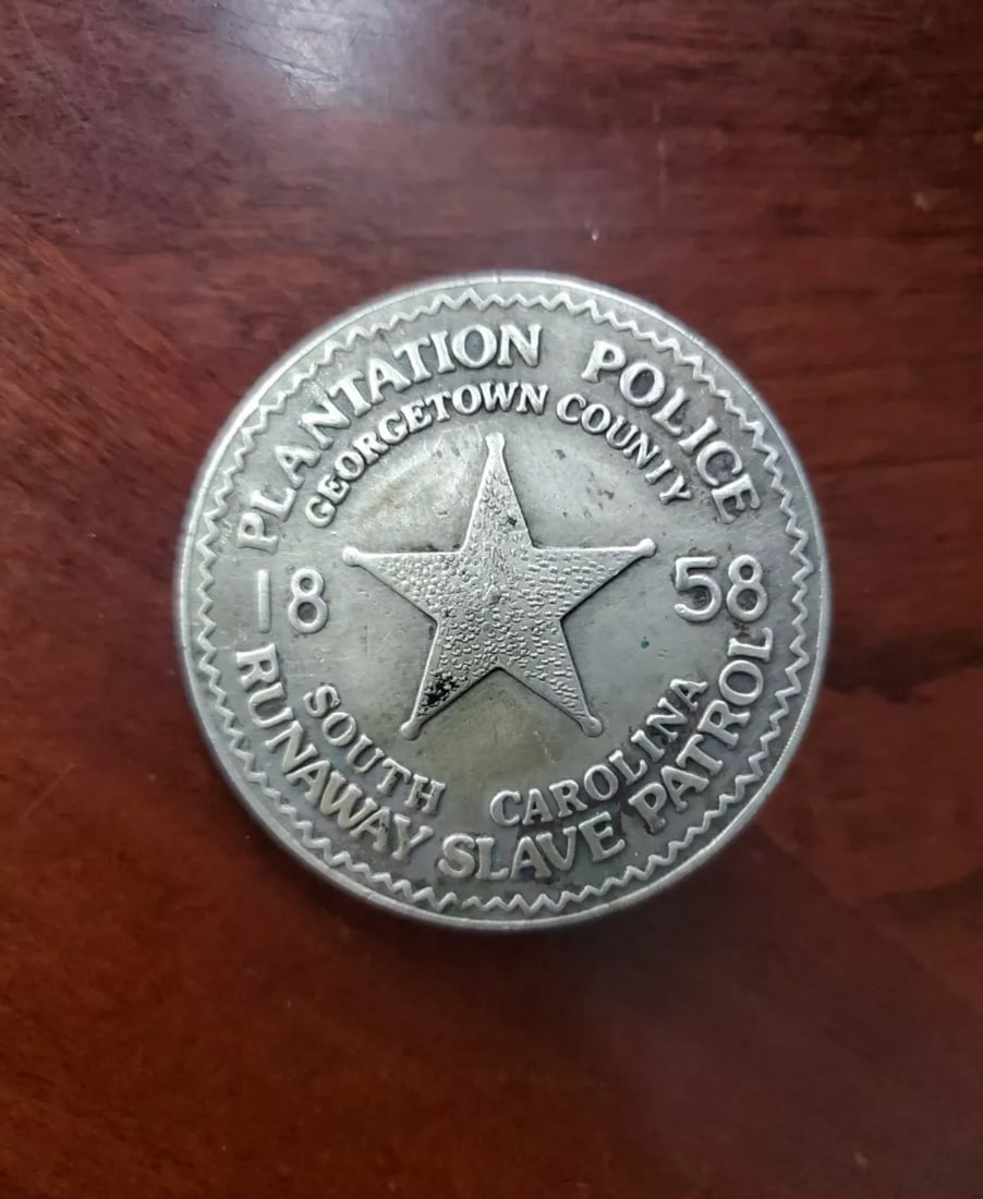 1858 PLANTATION POLICE RUNAWAY SLAVE PATROL SOUTH CAROLINA BADGE - GEORGETOWN COUNTY: 1858 PLANTATION POLICE RUNAWAY SLAVE PATROL SOUTH CAROLINA BADGE - GEORGETOWN COUNTY. A VERY RARE FIND THAT IS IN MINT OVERALL SHAPE AND CONDITION WITH A OVERALL PATINA. PLEASE VIEW ALL DETAILED PICTU