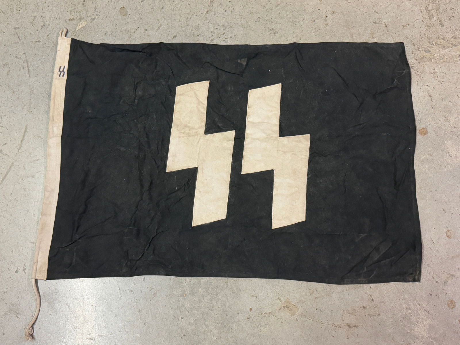 WW2 GERMAN WAFFEN SS 3RD REICH BANNER FLAG MARKED SS: WW2 GERMAN WAFFEN SS 3RD REICH BANNER FLAG MARKED SS. AN ULTRA RARE FIND THAT IS IN MINT OVERALL SHAPE AND CONDITION WITH A BEAUTIFUL OVERALL PATINA. SHOWS GOOD WEAR AND USE. PLEASE VIEW ALL DETAILED