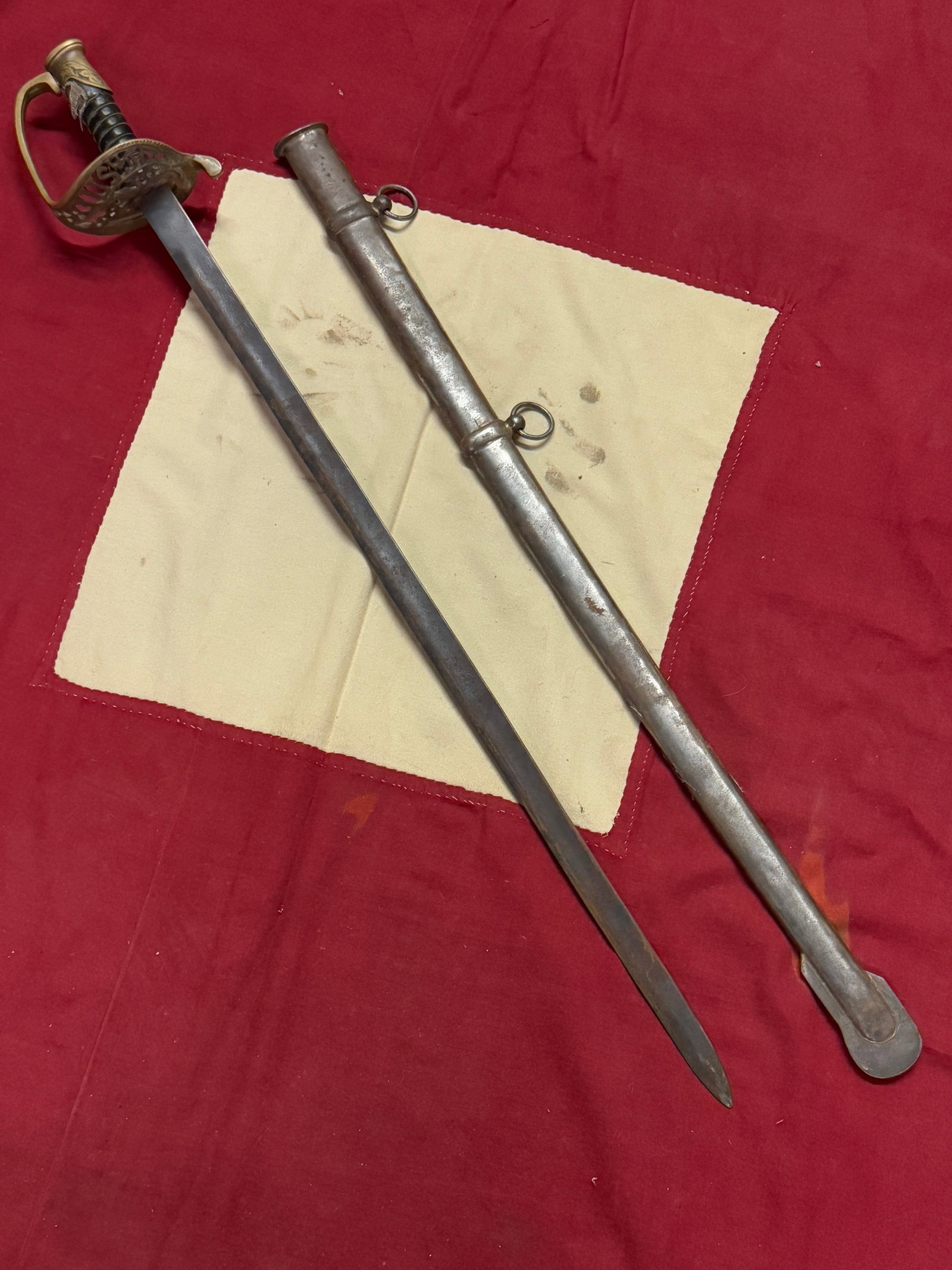 CIVIL WAR ENGRAVED BLADE CAVALRY SWORD WITH SHEATH: CIVIL WAR ENGRAVED BLADE CAVALRY SWORD WITH SHEATH. A VERY RARE FIND WITH AN ENGRAVED HILT MARKED U.S. COMES WITH THE THE ORIGINAL SHEATH. HAS A GREAT LOOK TO IT WITH AN EXCELLENT OVERALL PATINA. SHOW