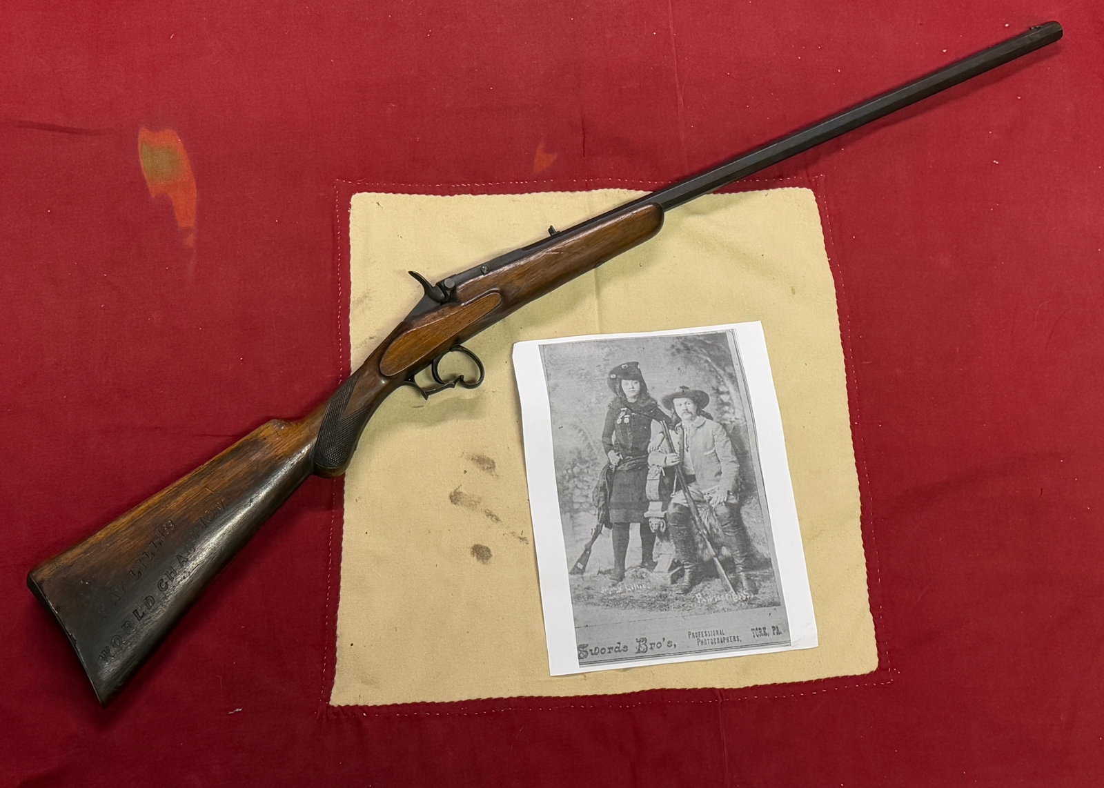 Belgian May Lillie 1893 World Champ Single Shot Rifle With Photograph: Belgian May Lillie 1893 World Champ Single Shot Rifle With Photograph. An ultra rare find. Shows good wear and use with a beautiful overall patina. The Butt of the rifle is marked May Lillie World Cha