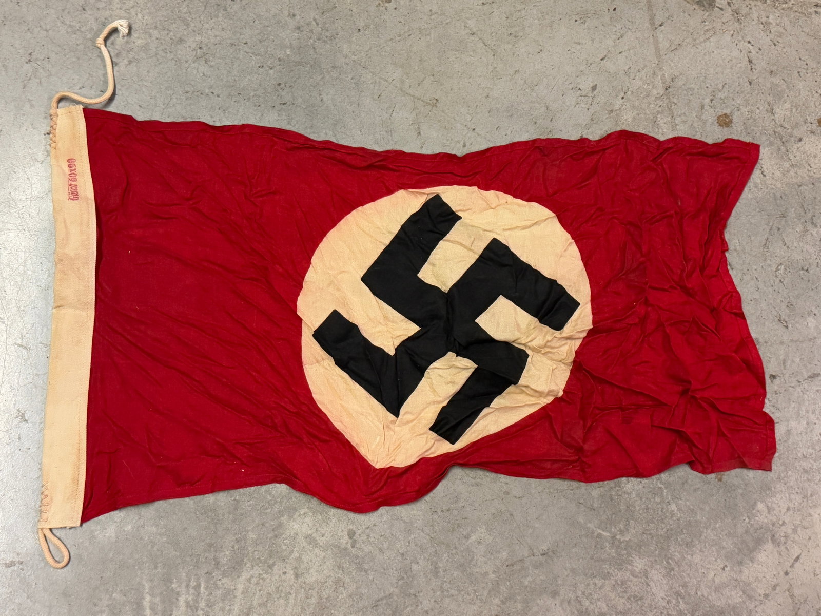 RARE WW2 GERMAN NSDAP FLAG BY GOSCH 60X90 MAKER MARKED: RARE WW2 GERMAN NSDAP FLAG BY GOSCH 60X90 MAKER MARKED. AN ULTRA RARE FIND THAT IS IN MINT OVERALL SHAPE AND CONDITION WITH A BEAUTIFUL OVERALL PATINA. SHOWS GOOD WEAR AND USE. PLEASE VIEW ALL DETAILE