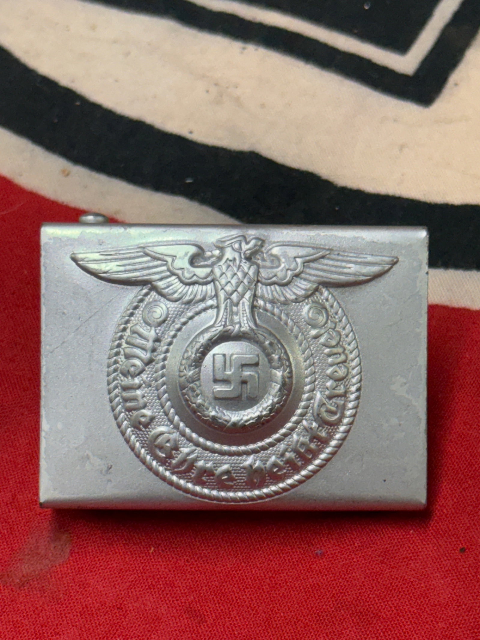 RARE WW2 GERMAN WAFFEN-SS ALUMINUM BELT BUCKLE BY RZM SS: RARE WW2 GERMAN WAFFEN-SS ALUMINUM BELT BUCKLE BY RZM SS. Light worn SS buckle in good condition. Executed in aluminum and maker marked on the reverse by RZM. A very rare example. Please view all deta