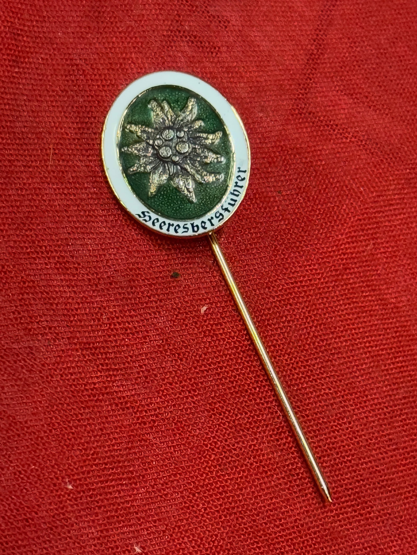 WW2 GERMAN WEHRMACHT ALPINE LEADER ENAMELED STICK PIN: WW2 GERMAN WEHRMACHT ALPINE LEADER ENAMELED STICK PIN. A RARE EXAMPLE. SHOWS GOOD WEAR AND USE WITH A BEAUTIFUL OVERALL PATINA. PLEASE VIEW ALL DETAILED PICTURES. A SCARCE EXAMPLE.