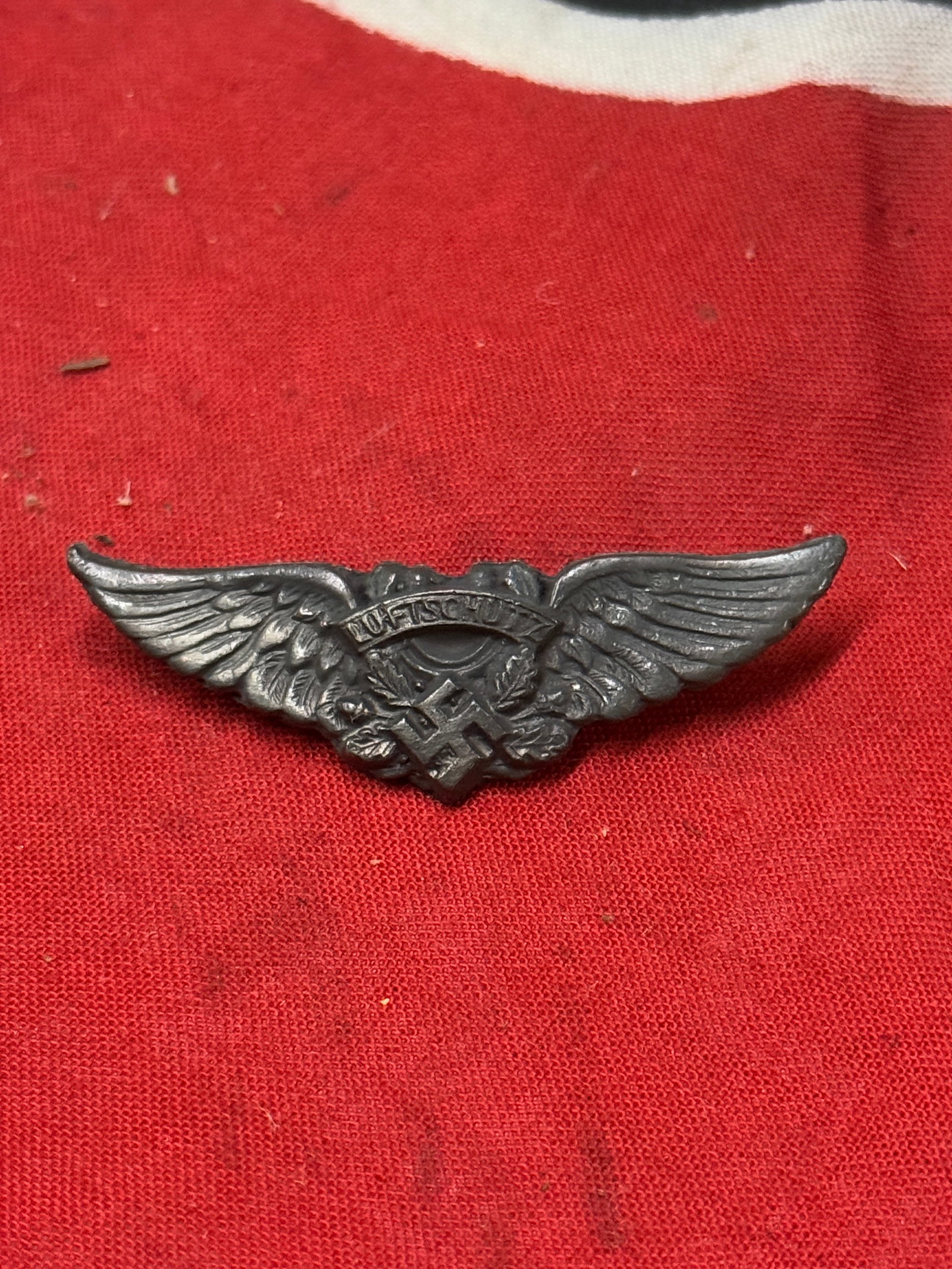 WW2 GERMAN LUFTSCHUTZ INSIGNIA CUT FROM A BELT BUCKLE: WW2 GERMAN LUFTSCHUTZ INSIGNIA CUT FROM A BELT BUCKLE. A RARE EXAMPLE THAT IS IN MINT OVERALL SAHPE AND CONDITION WITH A BEAUTIFUL OVERALL PATINA. SHOWS GOOD WEAR AND USE. PLEASE VIEW ALL DETAILED PIC