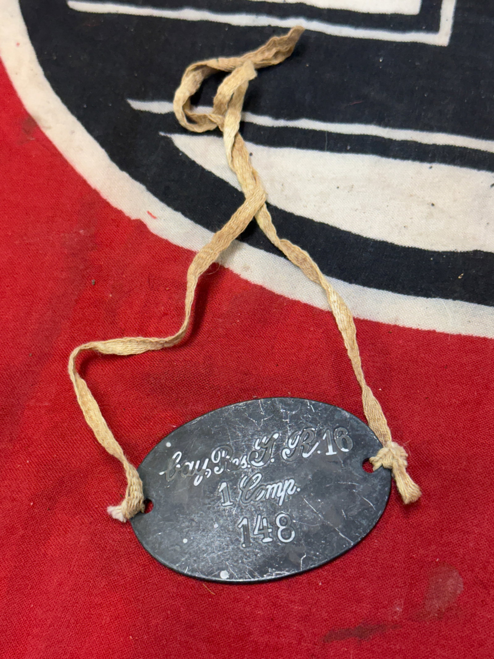 RARE WW2 GERMAN SOLDIER'S ID DOG TAG: RARE WW2 GERMAN SOLDIER'S ID DOG TAG. A VERY RARE EXAMPLE THAT IS IN MINT OVERALL SHAPE AND CONDITION WITH A BEAUTIFUL OVERALL PATINA. SHOWS GOOD WEAR AN USE. A SCARCE EXAMPLE.