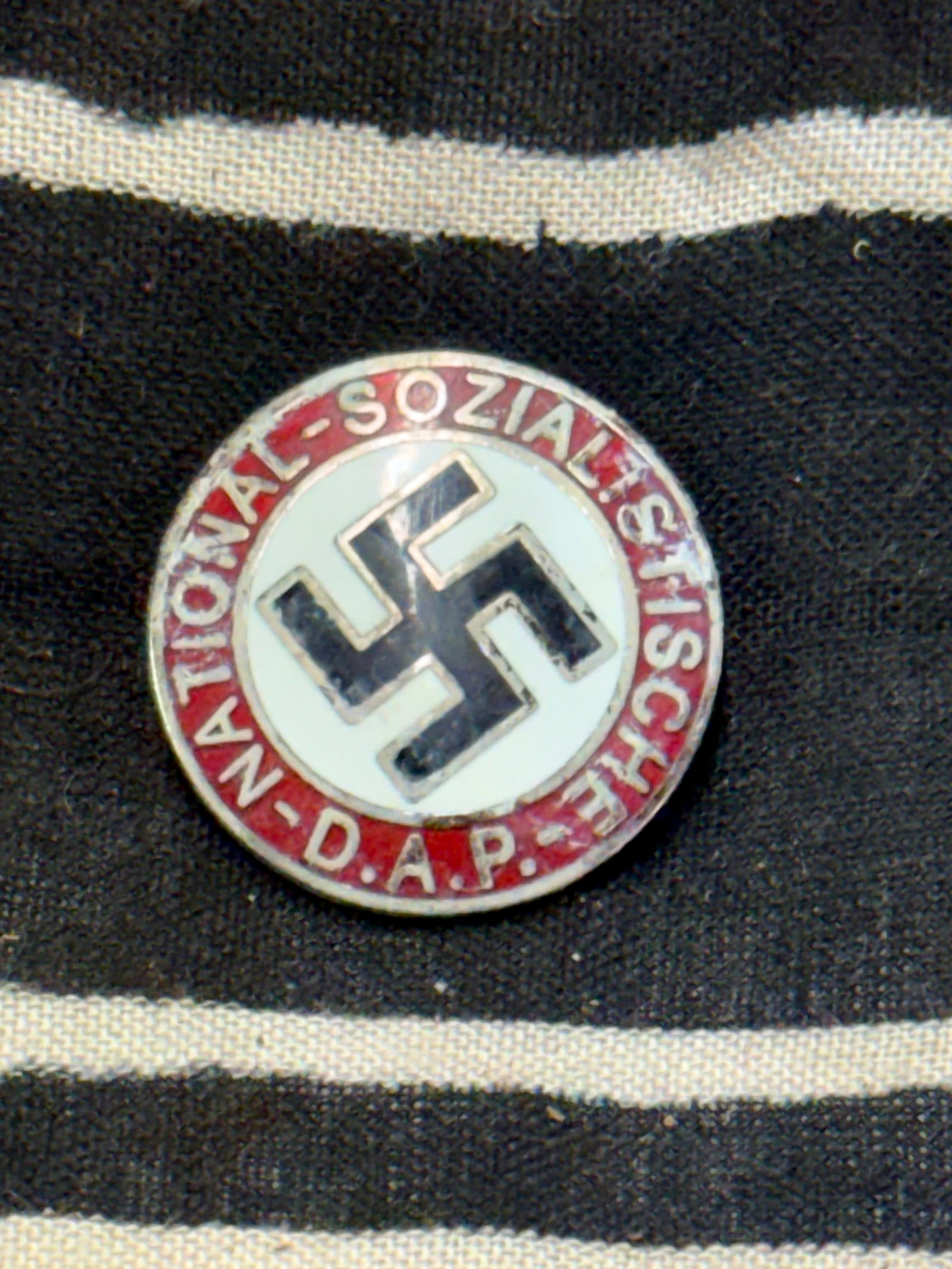 WW2 German NSDAP Membership Badge by “RZM M1/129: WW2 German NSDAP Membership Badge by “RZM M1/129”. A rare example. Shows good wear and use with a beautiful overall patina. The enamaled is still present. Please view all detailed pictures. A 