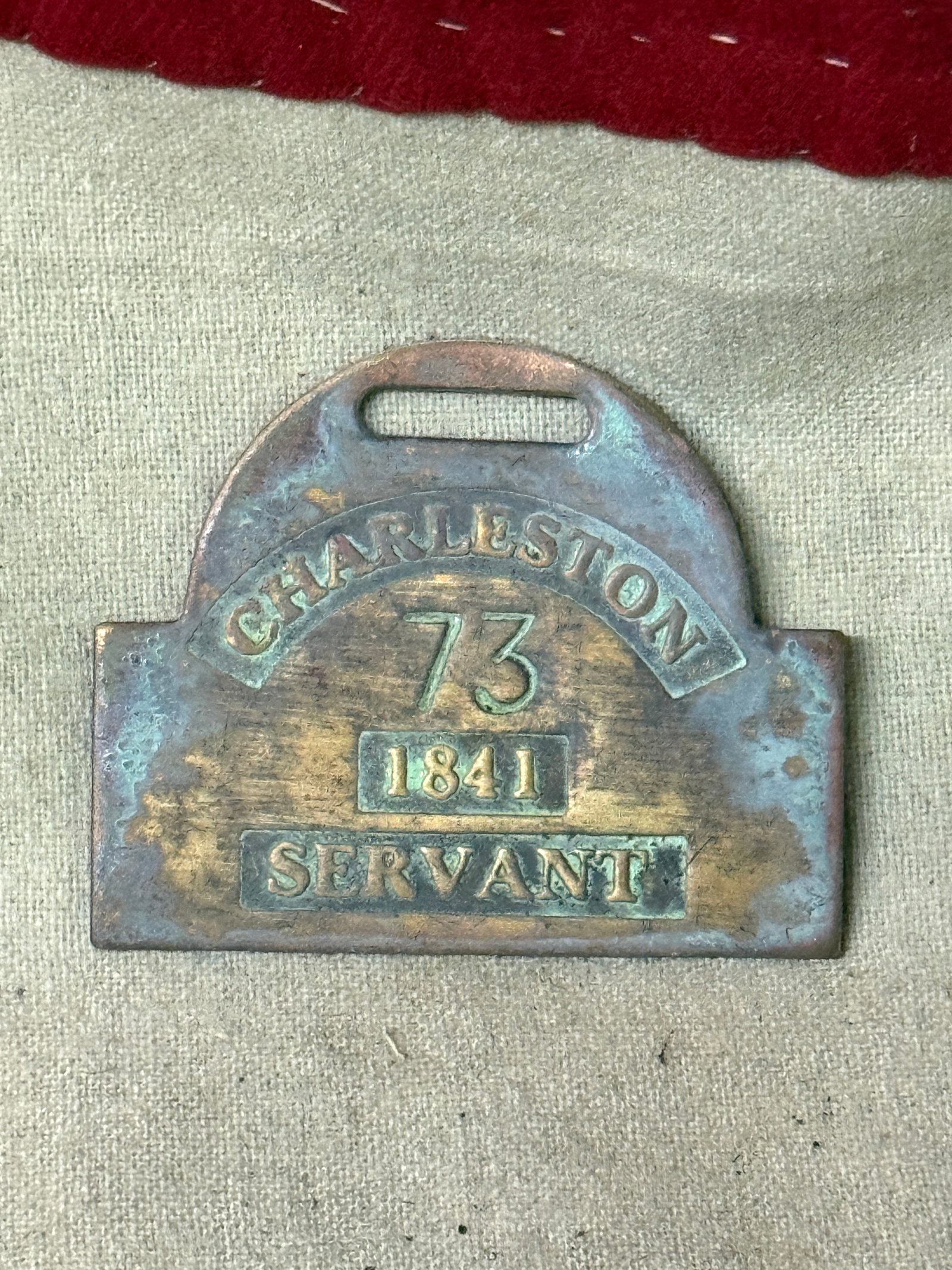DATED 1841 CHARLESTON #73 SLAVE TAG SERVANT ID: DATED 1841 CHARLESTON #73 SLAVE TAG SERVANT ID. AN ULTRA RARE FIND THAT IS IN MINT OVERALL SHAPE AND CONDITION WITH A BEAUTIFUL OVERALL PATINA. SHOWS GOOD WEAR AND USE. PLEASE VIEW ALL DETAILED PICTUR