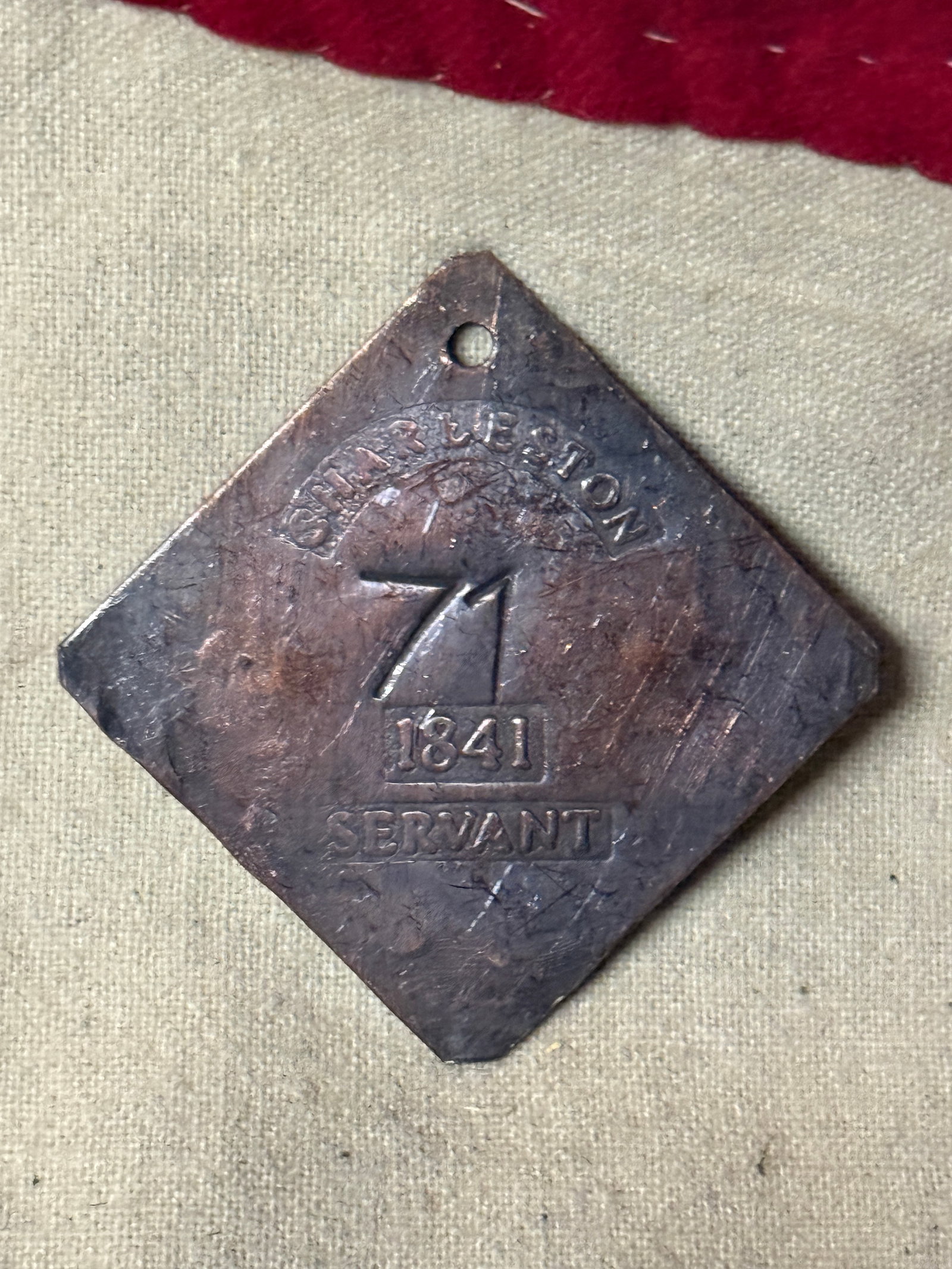 DATED 1841 CHARLESTON #71 SLAVE TAG SERVANT ID: DATED 1841 CHARLESTON #71 SLAVE TAG SERVANT ID. AN ULTRA RARE FIND THAT IS IN MINT OVERALL SHAPE AND CONDITION WITH A BEAUTIFUL OVERALL PATINA. SHOWS GOOD WEAR AND USE. PLEASE VIEW ALL DETAILED PICTUR