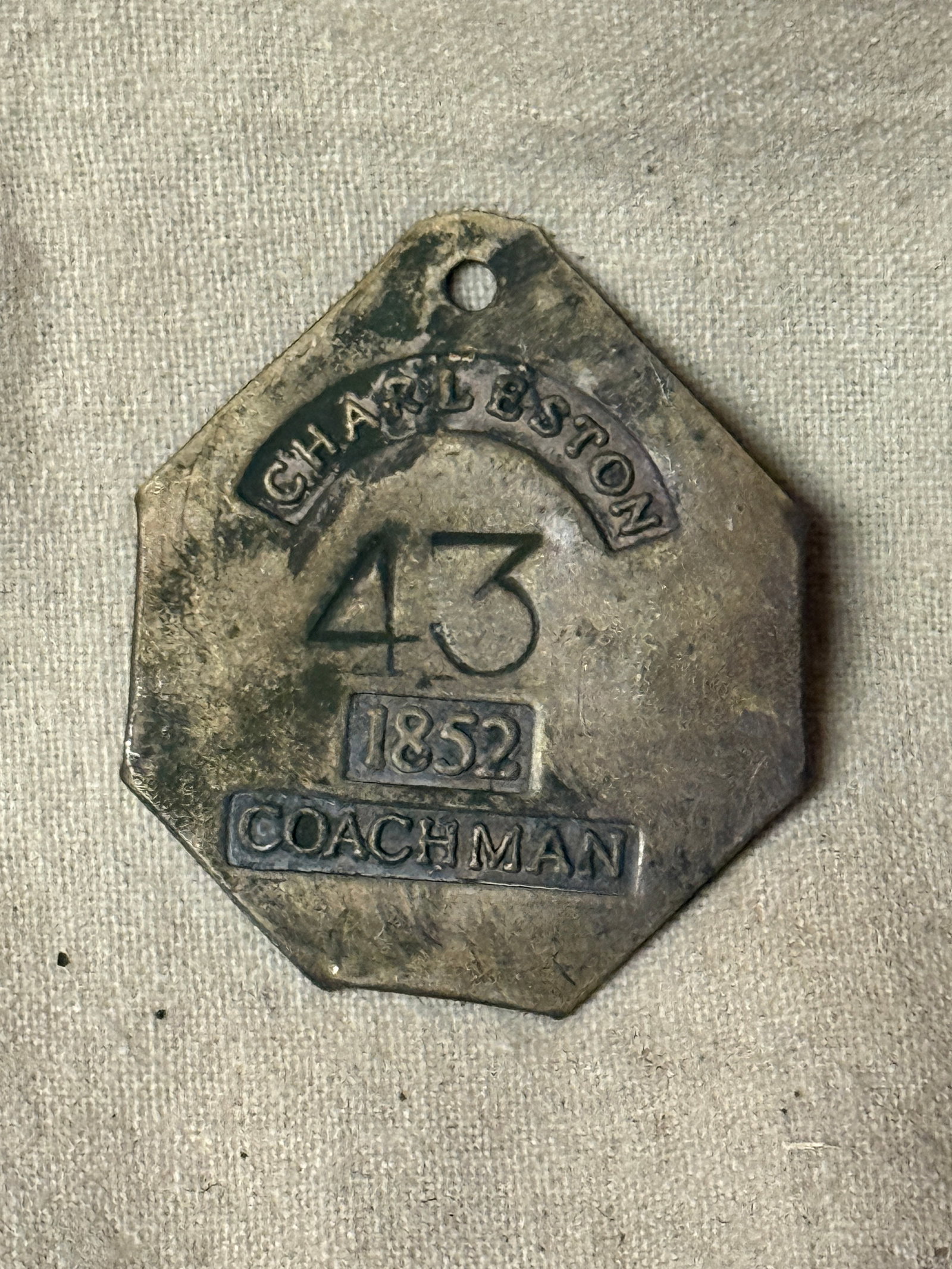 DATED 1852 #43 CHARLESTON COACHMAN SLAVE TAG SERVANT ID: DATED 1852 #43 CHARLESTON COACHMAN SLAVE TAG SERVANT ID. AN ULTRA RARE FIND THAT IS IN MINT OVERALL SHAPE AND CONDITION WITH A BEAUTIFUL OVERALL PATINA. SHOWS GOOD WEAR AND USE. PLEASE VIEW ALL DETAIL