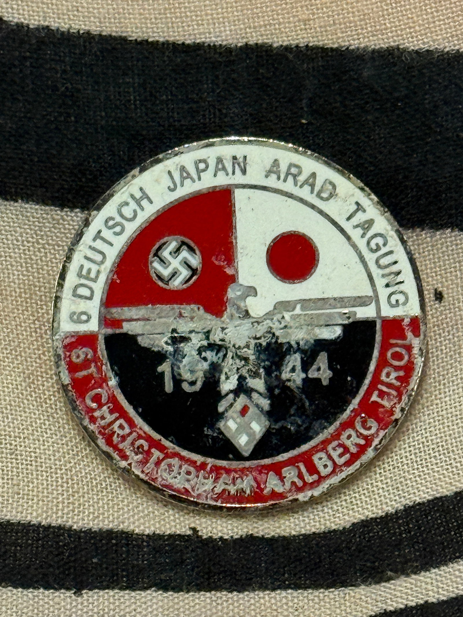 WW2 GERMAN ENAMELED LAPEL BADGE OF THE GERMANY-JAPAN MEETING OF 1942 BY RZM: WW2 GERMAN ENAMELED LAPEL BADGE OF THE GERMANY-JAPAN MEETING OF 1942 BY RZM. AN ULTRA RARE FIND THAT IS IN MINT OVERALL SHAPE AND CONDITION WITH A BEAUTIFUL OVERALL PATINA. PLEASE VIEW ALL DETAILED PI