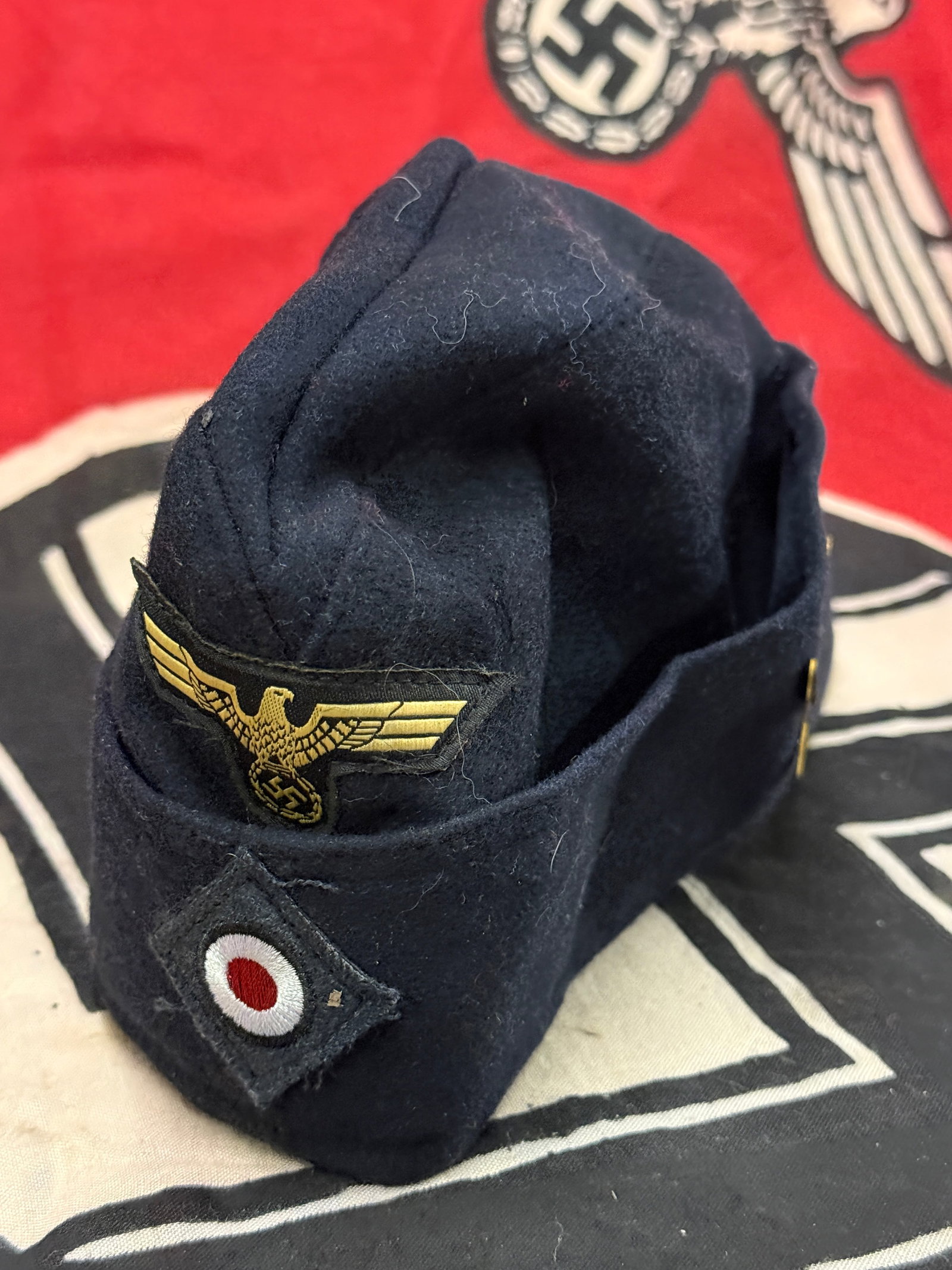 WW2 German Kriegsmarine Enlisted Man’s Side Cap with U-Boat Flotilla Insignia & Maker Marks: WW2 German Kriegsmarine Enlisted Man’s Side Cap with U-Boat Flotilla Insignia & Maker Marks. A very rare example showing good field wear and use with a beautiful patina throughout. Has the maker sta