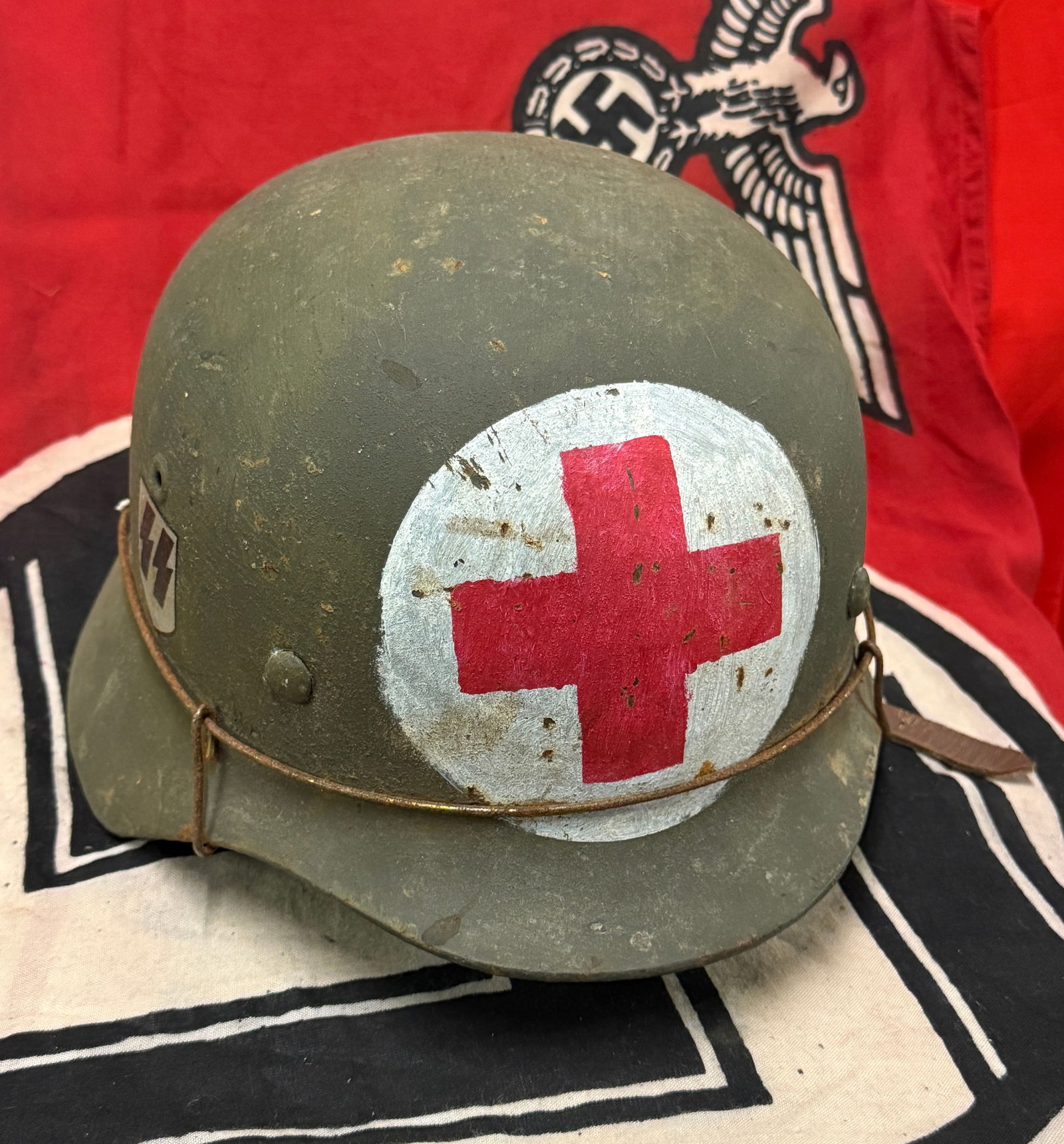 WW2 GERMAN WAFFEN-SS MEDICS DOUBLE DECAL HELMET WITH LINER - COMPLETE: WW2 GERMAN WAFFEN-SS MEDICS DOUBLE DECAL HELMET WITH LINER - COMPLETE. AN ULTRA RARE FIND THAT IS IN MINT OVERALL SHAPE AND CONDITIO WITH A BEAUTIFUL OVERALL PATINA. COMES COMPLETE WITH THE INSIDE LIN