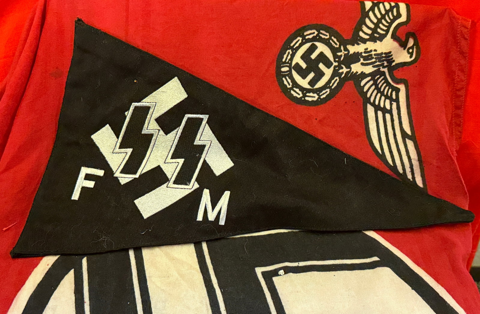 RARE WW2 GERMAN WAFFEN-SS FM PENNANT: RARE WW2 GERMAN WAFFEN-SS FM PENNANT. AN ULTRA RARE FIND, SHOWCASING GOOD WEAR AND USE WITH A BEAUTIFUL PATINA THROUGHOUT. FIELD WORN AND USE. PLEASE VIEW ALL DETAILED PICTURES. A VERY RARE DOUBLE SID