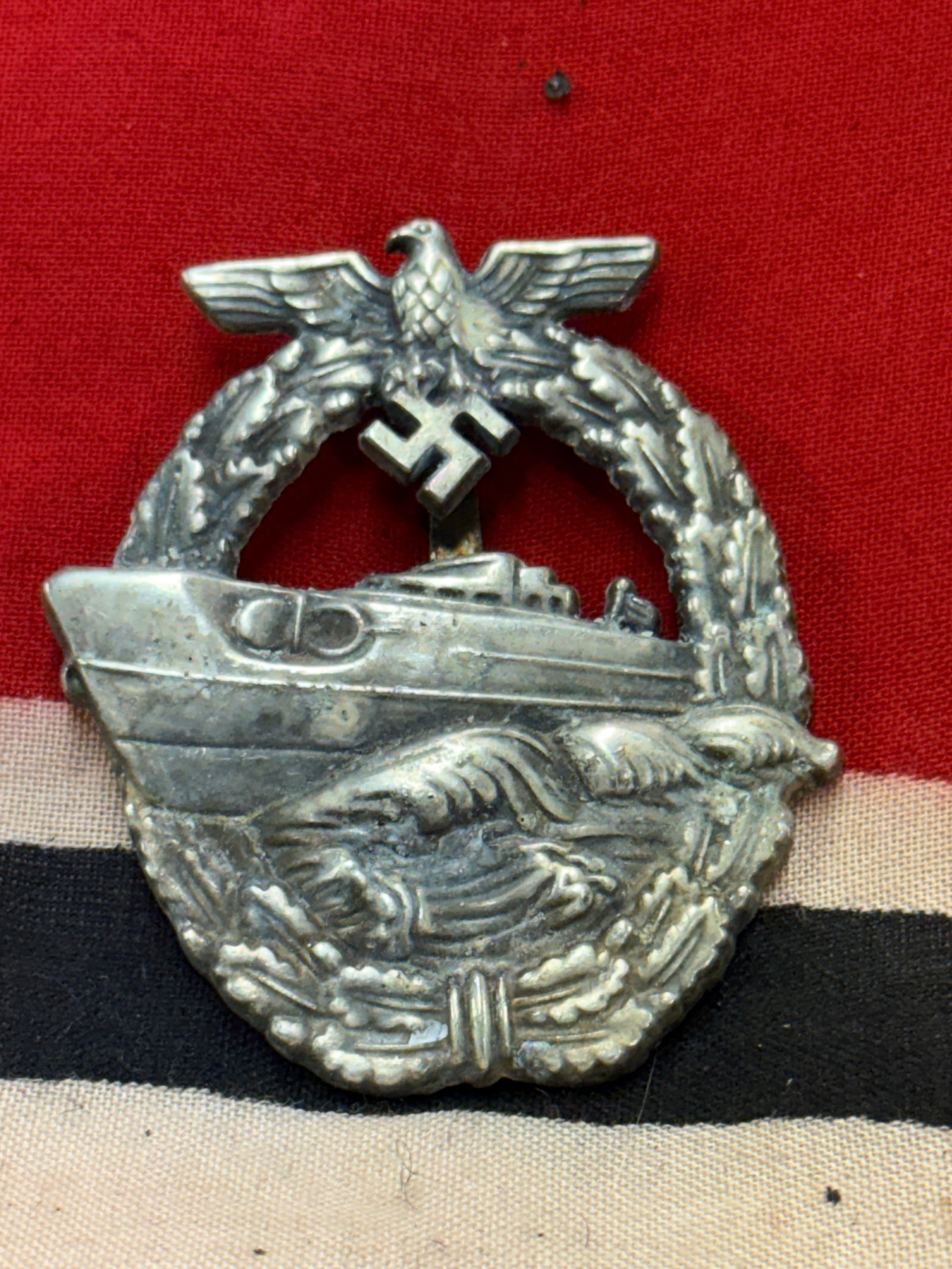 WW2 German A Third Reich 2nd pattern E boat badge, marked “FEC.W.E. PEE.: WW2 German A Third Reich 2nd pattern E boat badge, marked “FEC.W.E. PEE. A rare find showcasing good wear and use with a beautiful overall patina. Maker marked on the reverse. Please view all detail