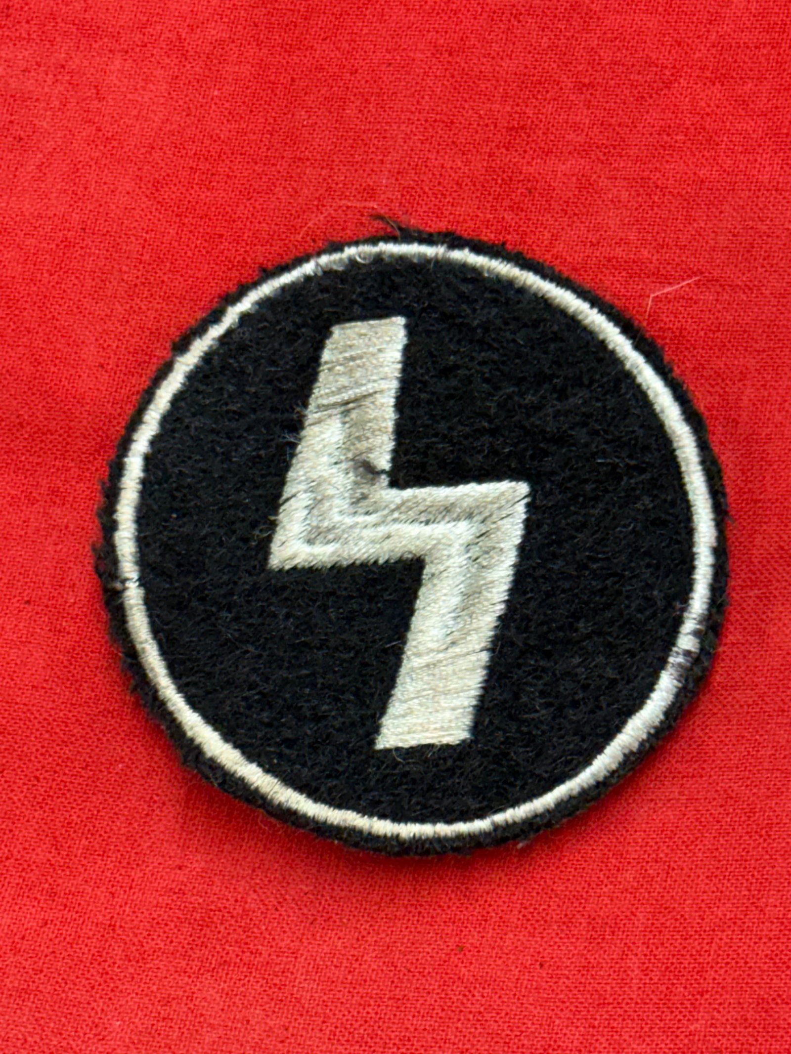 WW2 German Deutsches Jungvolk DJ/NPEA NAPOLA Sigrune Sleeve Patch: WW2 German Deutsches Jungvolk DJ/NPEA NAPOLA Sigrune Sleeve Patch. The youngest group of Hitler Jugend (HJ) organization for 10-14 years old boys. Jacket removed. 1935 pattern, machine woven, black si
