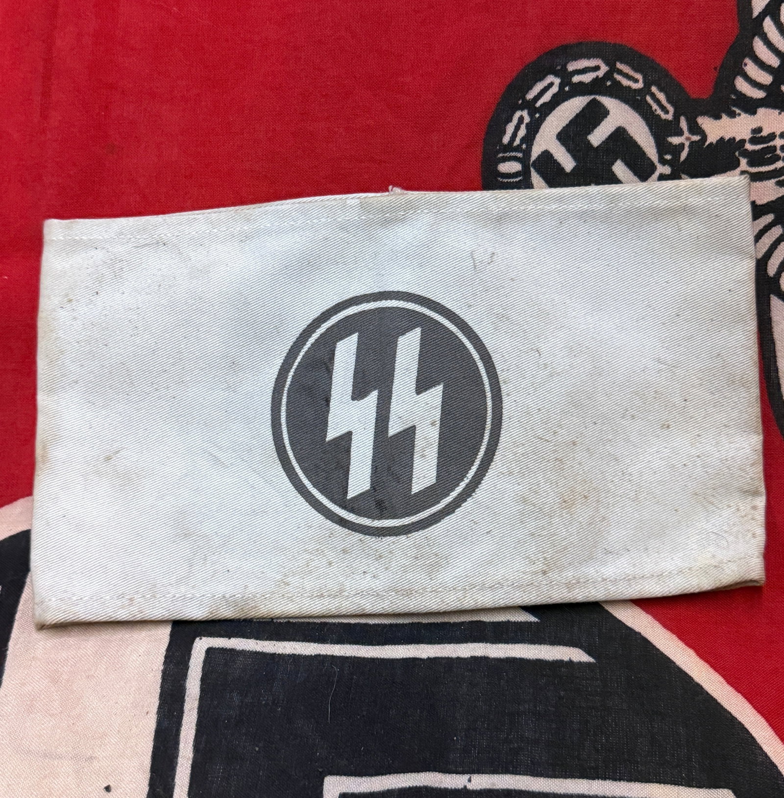 WW2 GERMAN 3RD REICH SS ARMBAND WITH RZM PAPER TAG: WW2 GERMAN 3RD REICH SS ARMBAND WITH RZM PAPER TAG. AN ULTRA RARE FIND THAT IS IN MINT OVERALL SHAPE AND CONDITION WITH A BEAUTIFUL OVERALL PATINA. IN WELL USED SHAPE AND OVERALL CONDITION. PLEASE VIE