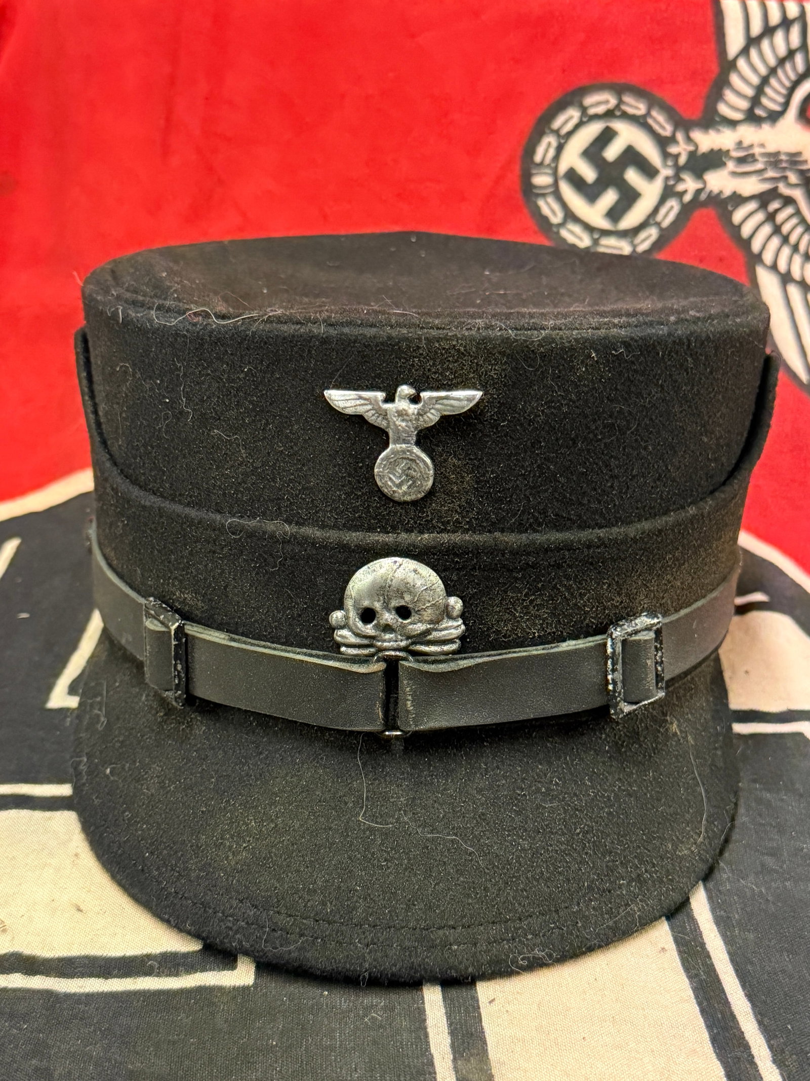 WWII GERMAN REICH SS COFFEE CAN KEPI HAT: WWII GERMAN REICH SS COFFEE CAN KEPI HAT. Early style kepi. Shows good wear and use with a beautiful overall patina throughout. Comes complete with no missing pieces visible. Please view all detailed 