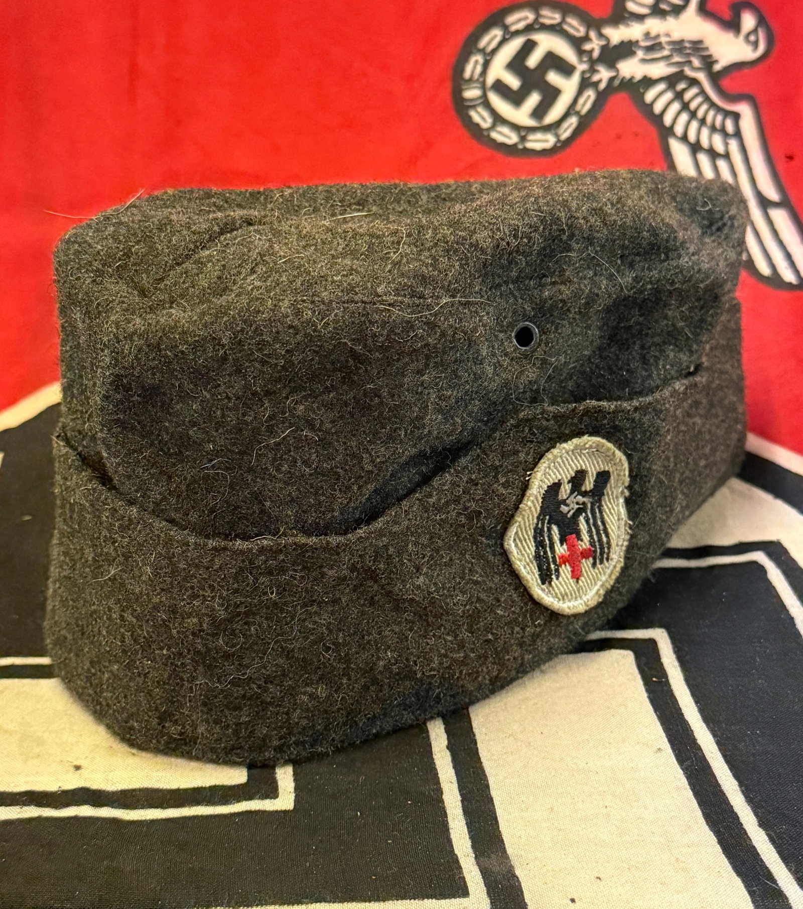 WW2 GERMAN 3RD REICH DRK SIDE CAP: WW2 GERMAN 3RD REICH DRK SIDE CAP. Third Reich DRK Side Cap-This cap is produced in gray wool that is excellent. The left side of the cap has a machine woven DRK motto with a black eagle, white backgr