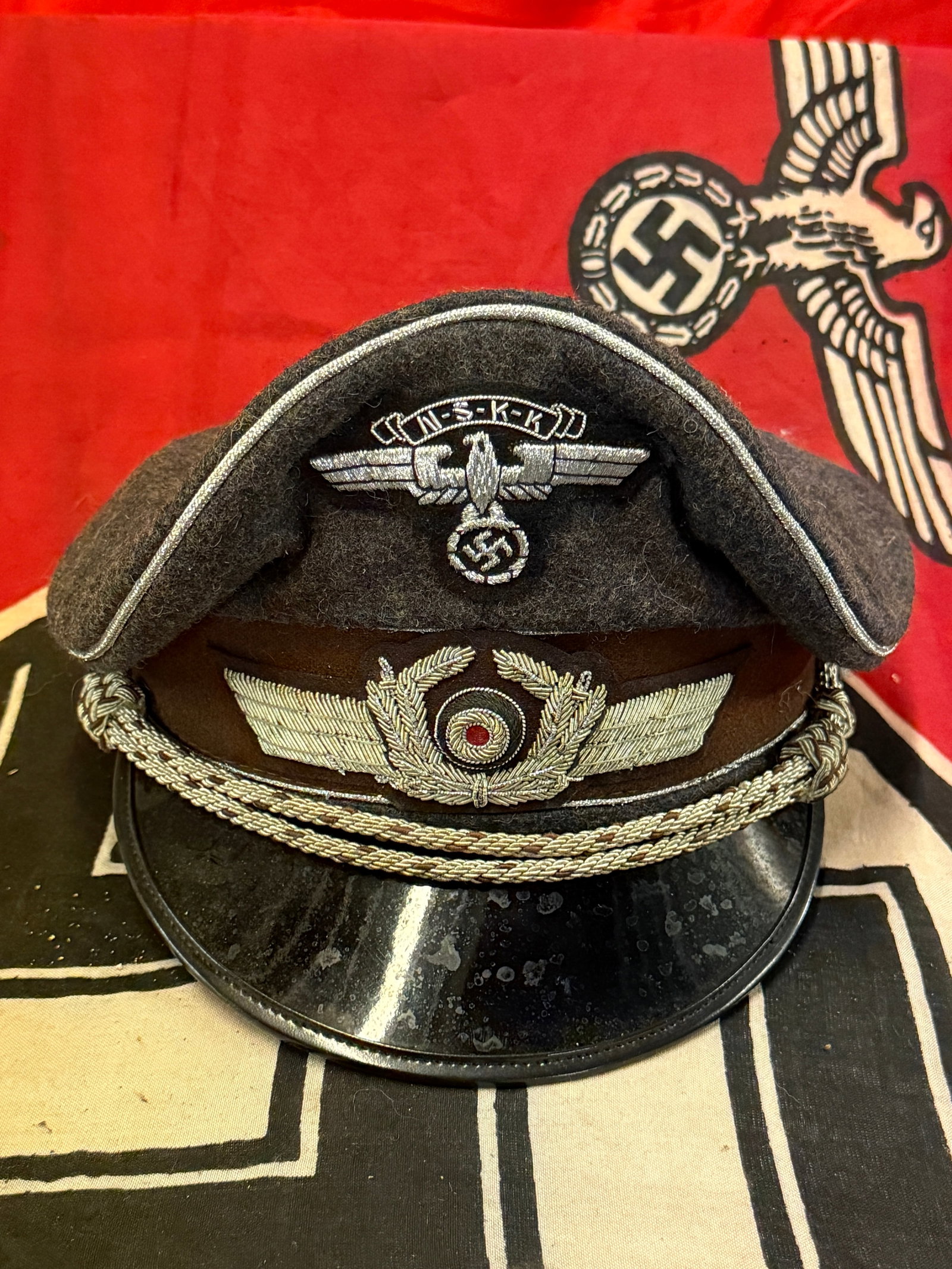 WWII GERMAN THIRD REICH LUFTWAFFE OFFICER VISOR CAP - MAKER MARKED: WWII GERMAN THIRD REICH LUFTWAFFE OFFICER VISOR CAP - MAKER MARKED. AN ULTRA RARE FIND THAT IS IN MINT OVERALL SHAPE AND CONDITION WITH A BEAUTIFUL OVERALL PATINA. Wool visor with silver piping, cocka