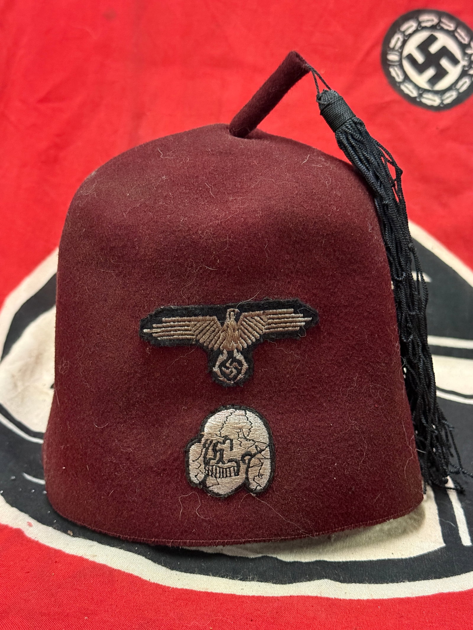 German WWII Waffen SS M43 Maroon Parade Fez for Foreign Volunteers: German WWII Waffen SS M43 Maroon Parade Fez for Foreign Volunteers. A very rare find that is in mint overall shape and condition with a beautiful overall patina. Marked on the inside with size 61. In 