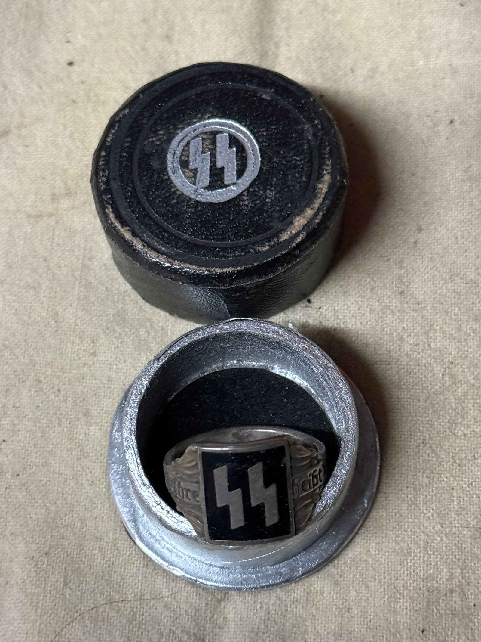 WW2 GERMAN 3RD REICH SS OFICER SILVER RING IN ORIGINAL SS BOX: WW2 GERMAN 3RD REICH SS OFICER SILVER RING IN ORIGINAL SS BOX. A VERY RARE FIND. SHOWS GOOD WEAR AND USE WITH A BEAUTIFUL PATINA THROUGHOUT. PLEASE VIEW ALL DETAILED PICTURES. A SCARCE EXAMPLE.