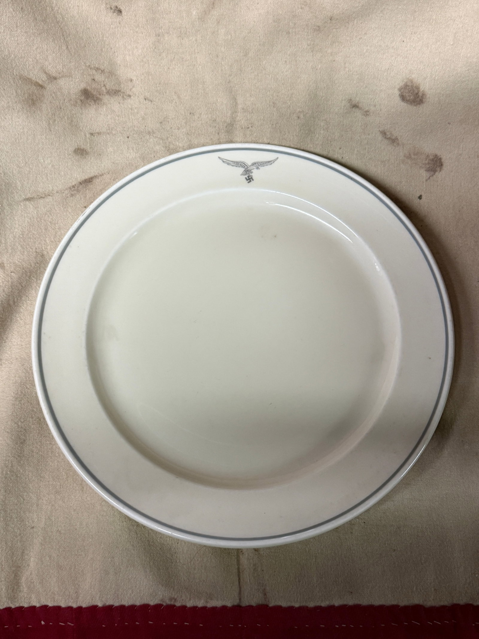 WW2 GERMAN LUFTWAFFE PILOTS PORCELAIN PLATE BY JURSTENBERG: WW2 GERMAN LUFTWAFFE PILOTS PORCELAIN PLATE BY JURSTENBERG. A RARE FIND. SHOWS GOOD WEAR AND USE WITH A BEAUTIFUL OVERALL PATINA. PLEASE VIEW ALL DETAILED PICTURES. A SCARCE FIND.