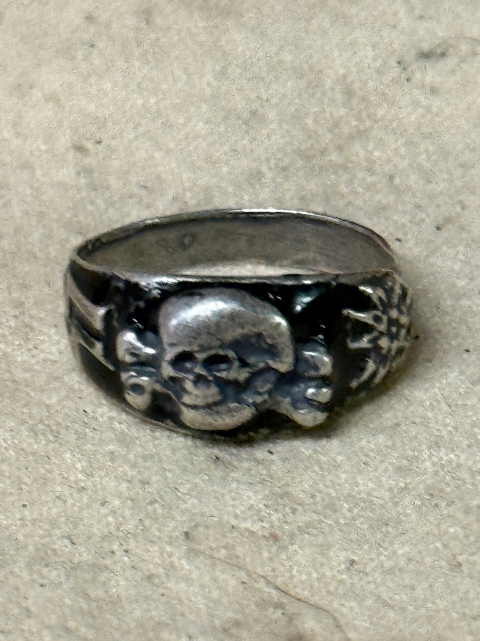 WW2 GERMAN WAFFEN SS TOTENKOPF SILVER RING WITH SKULL AND SS RUNES: WW2 GERMAN WAFFEN SS TOTENKOPF SILVER RING WITH SKULL AND SS RUNES. AN ULTRA RARE FIND THAT IS IN MINT OVERALL SHAPE AND CONDITION WITH A BEAUTIFUL OVERALL PATINA. SHOWS GOOD WEAR AND USE. PLEASE VIEW