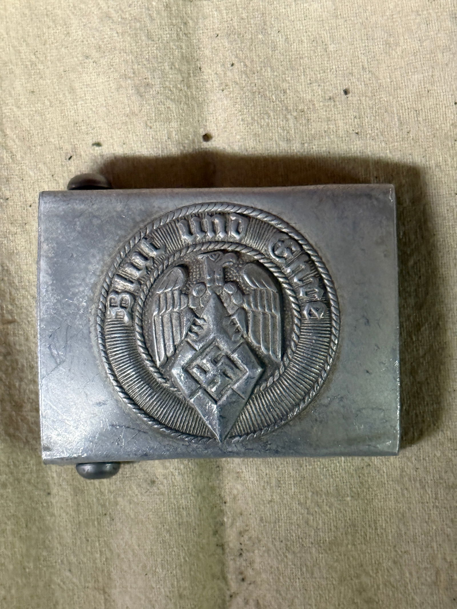 WW2 German Hitler Youth Belt Buckle Produced in Zinc By RZM M34/2: WW2 German Hitler Youth Belt Buckle Produced in Zinc By RZM M34/2. Shows good wear and use with a beautiful overall patina. Maker marked on the reverse. Please view all detailed pictures. A scarce exa