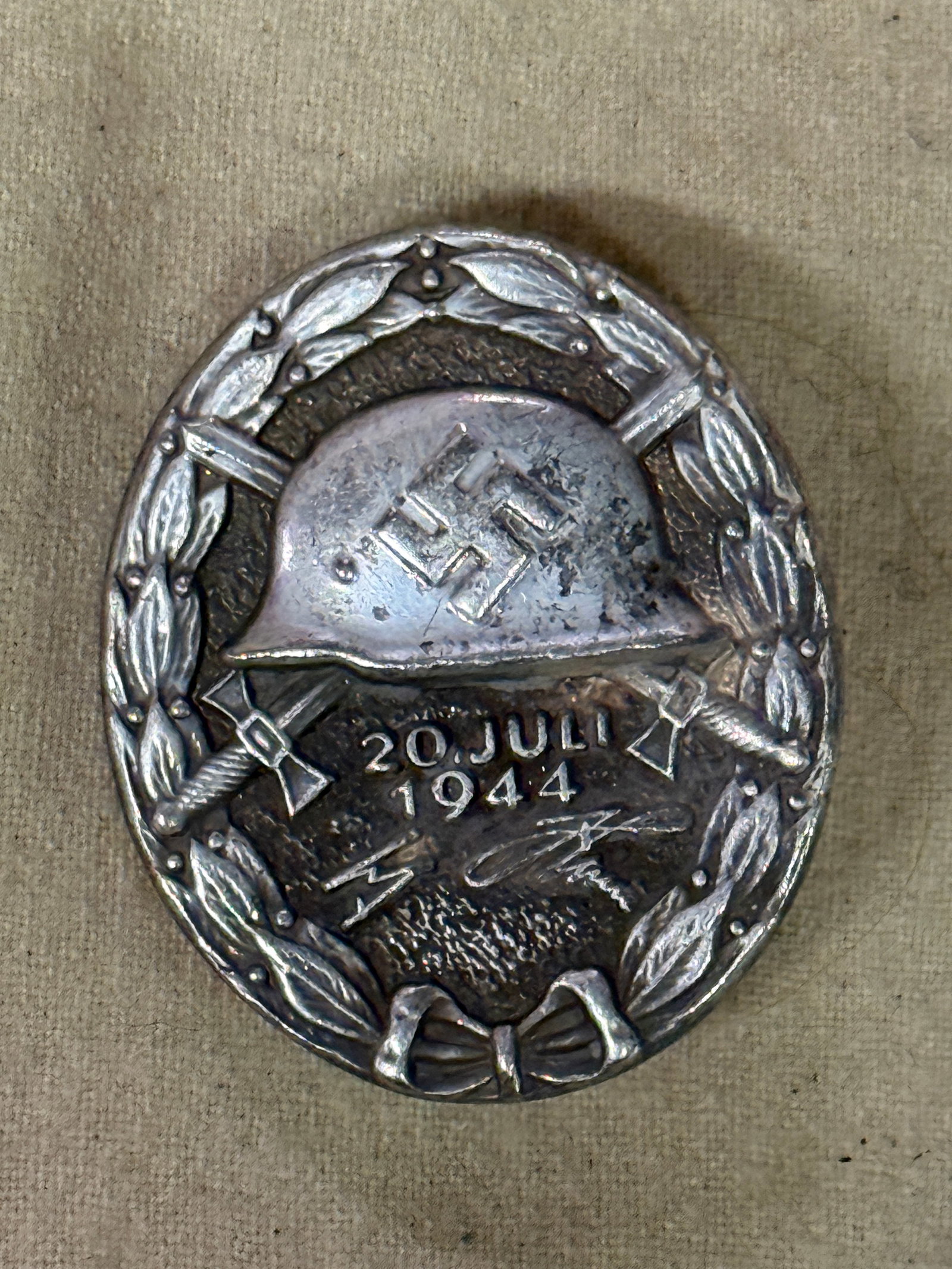 WWII GERMAN THIRD REICH ADOLF HITLER SILVER WOUND BADGE IN 800 SILVER MARKED 2: WWII GERMAN THIRD REICH ADOLF HITLER SILVER WOUND BADGE IN 800 SILVER MARKED 2. AN ULTRA RARE FIND. SHOWS GOOD WEAR AND USE WITH A BEAUTIFUL OVERALL PATINA. MARKED 800 SILVER WITH THE #2. ADOLF HITLER