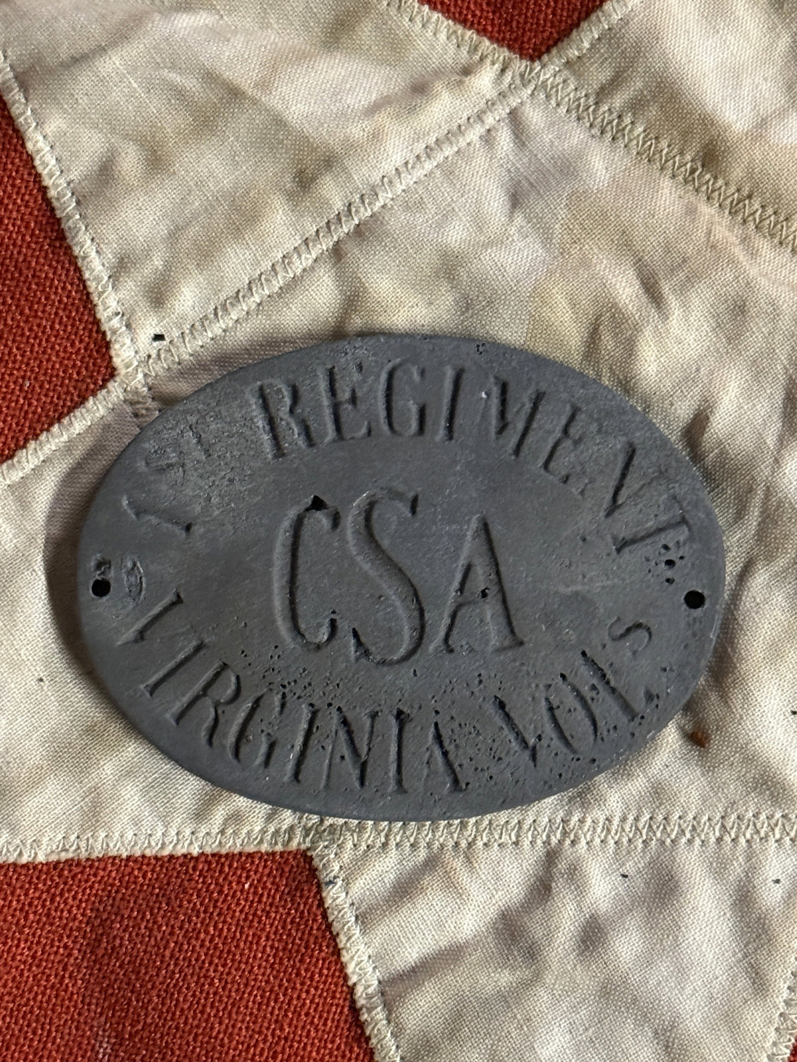 CIVIL WAR CONFEDERATE CSA 1ST VIRGINIA VOLS REGIMENT PLATE 1864: CIVIL WAR CONFEDERATE CSA 1ST VIRGINIA VOLS REGIMENT PLATE 1864. A VERY RARE FIND. SHOWS GOOD WEAR AND USE WITH A BEAUTIFUL OVERALL PATINA. HAS A GREAT LOOK TO IT WITH AN EXCELLENT OVERALL EYE APPEAL.