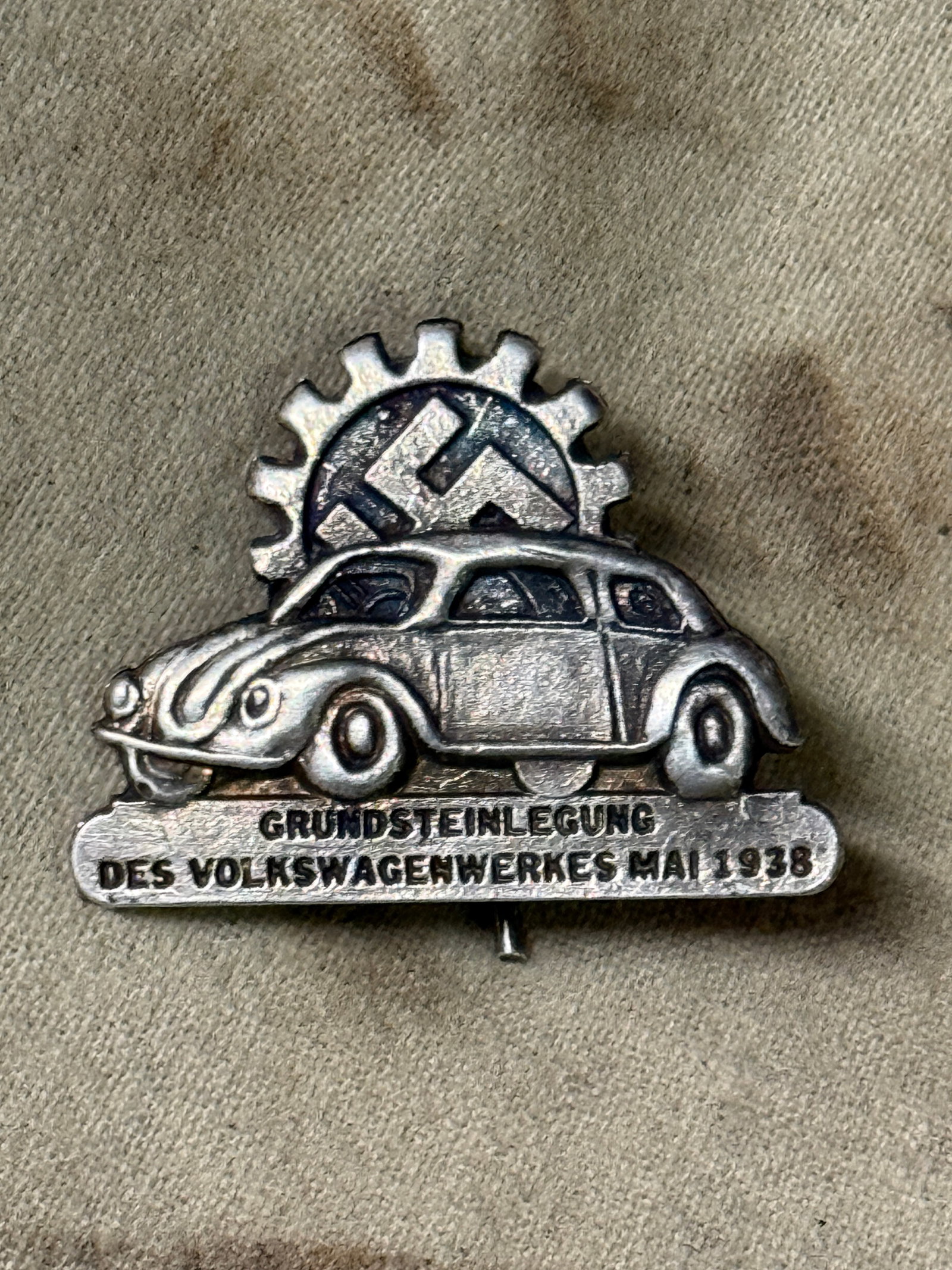 German World War II 1938 Volkswagen VW Ground Breaking Plant Badge By RZM: German World War II 1938 Volkswagen VW Ground Breaking Plant Badge By RZM. A rare find. Shows good wear and use with a beautiful overall patina. Please view all detailed pictures. A very rare find.