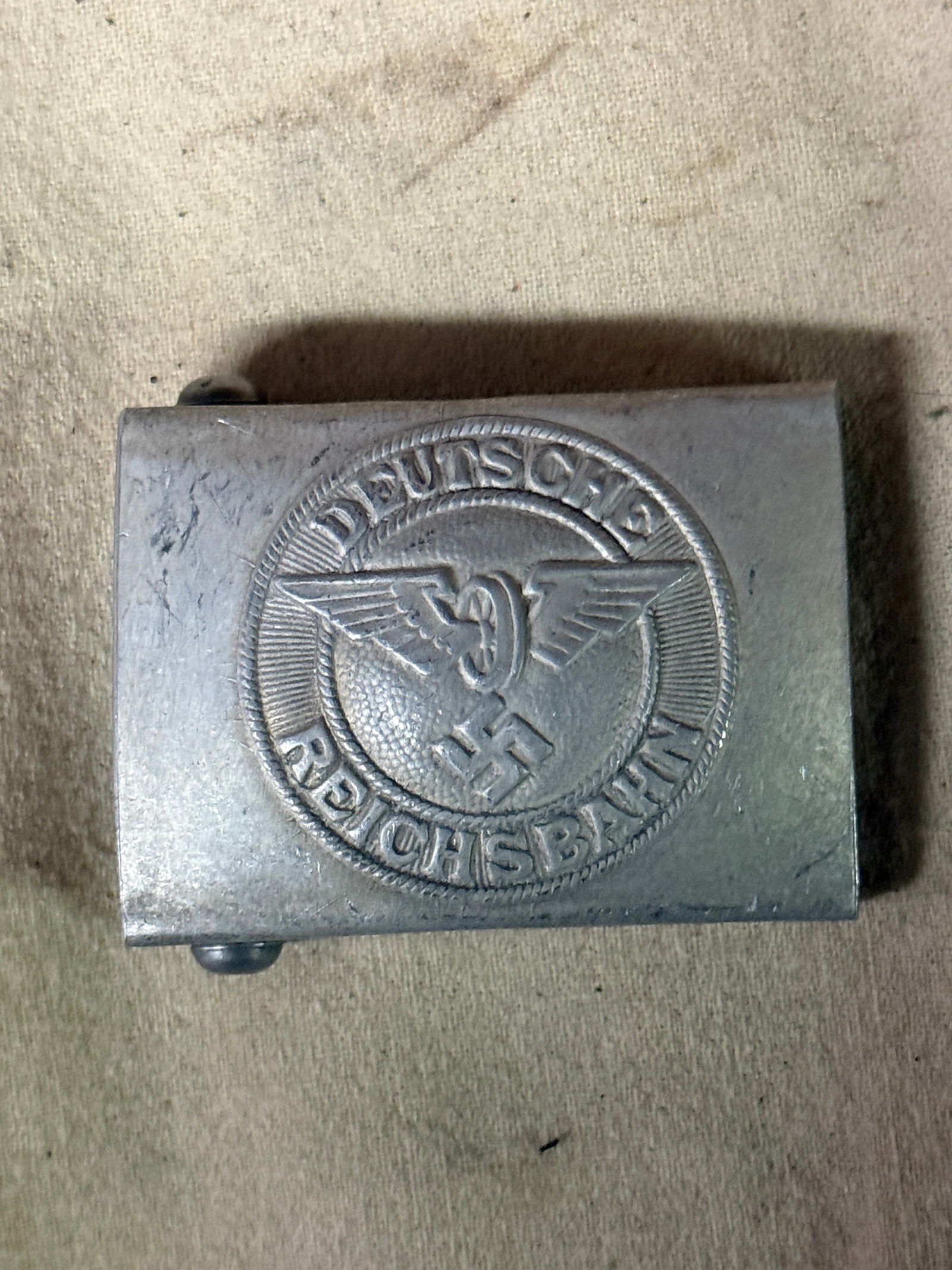 RAILWAY POLICE PROTECTION FORCE ENLISTED BELT BUCKLE REICHSBAHN BY RZM M34/2: RAILWAY POLICE PROTECTION FORCE ENLISTED BELT BUCKLE REICHSBAHN BY RZM M34/2. A VERY RARE FIND. SHOWS GOOD WEAR AND USE WITH A BEAUTIFUL OVERALL PATINA. PLEASE VIEW ALL DETAILED PICTURES. A VERY RARE