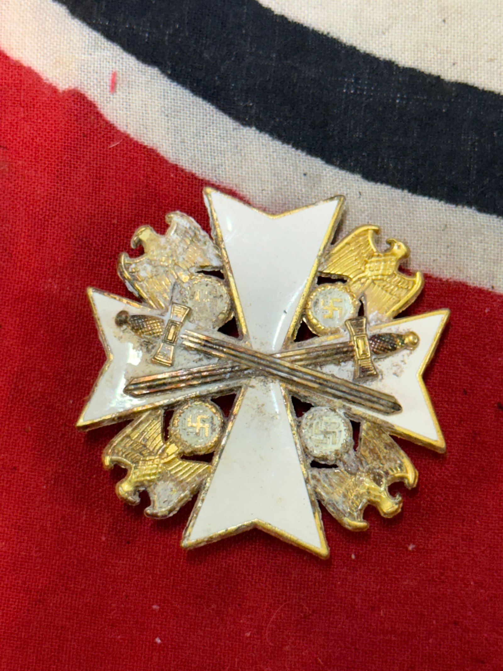 WWII German Eagle Order Breast Cross With Crossed Swords Marked 900 L/50: WWII German Eagle Order Breast Cross With Crossed Swords Marked 900 L/50. A VERY RARE FIND THAT IS IN MINT OVERALL SHAPE AND CONDITION WITH A BEAUTIFUL OVERALL PATINA. SHOWS GOOD WEAR AND USE. PLEASE 