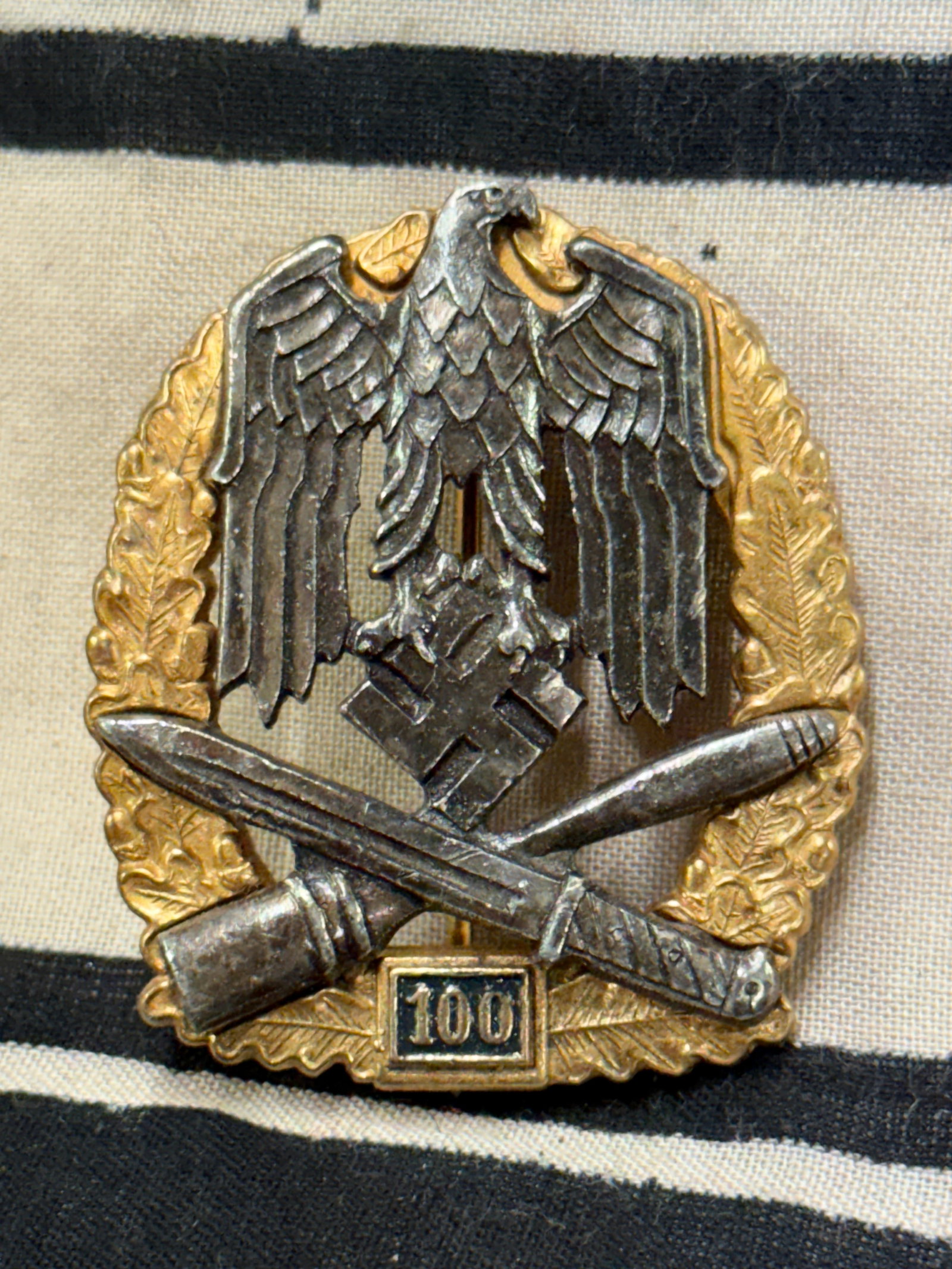 WWII German General Assault Badge Numbered 100 For Engagements By JFS: WWII German General Assault Badge Numbered 100 For Engagements By JFS. The Numbered General Assault Badge was instituted on June 22, 1943. This was in direct response to the increasing number of soldi