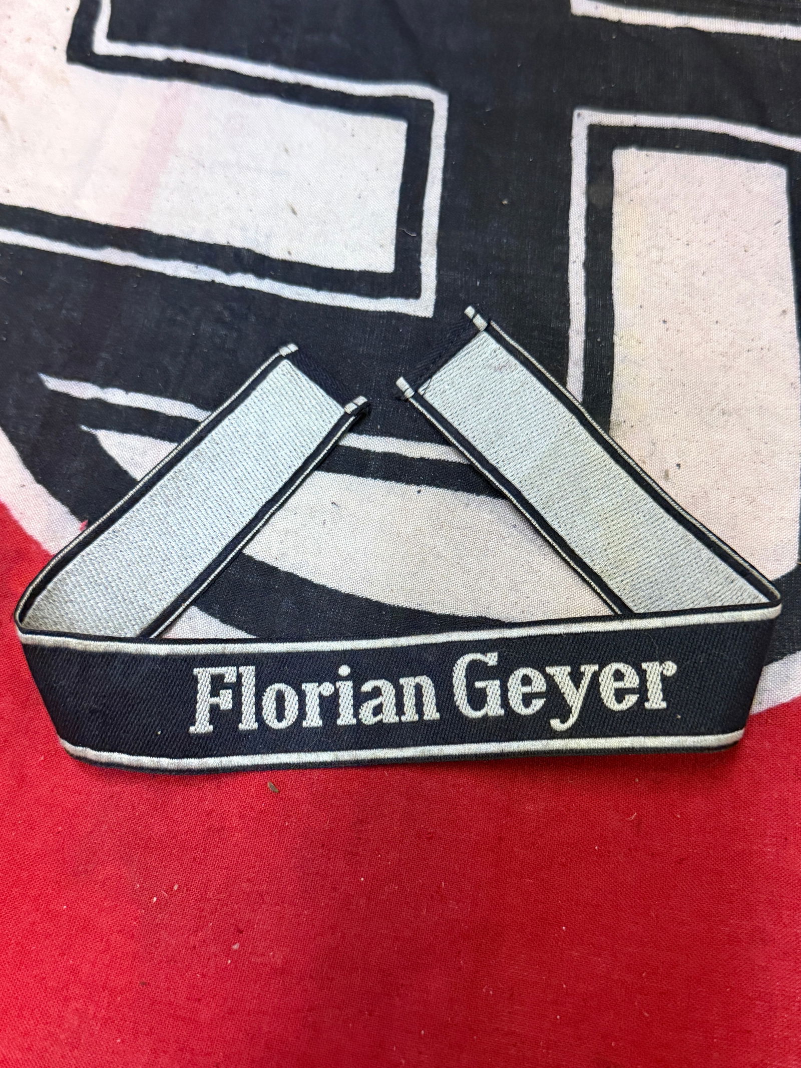 WW2 GERMAN WAFFEN SS DIVISION FLORIAN GYER CUFF TITLE: WW2 GERMAN WAFFEN SS DIVISION FLORIAN GYER CUFF TITLE. A VERY RARE EXAMPLE THAT IS IN MINT OVERALL SHAPE AND OCNDITION WITH A BEAUTIFUL OVERALL PATINA. PLEASE VIEW ALL DETAILED PICTURES. A VERY RARE E